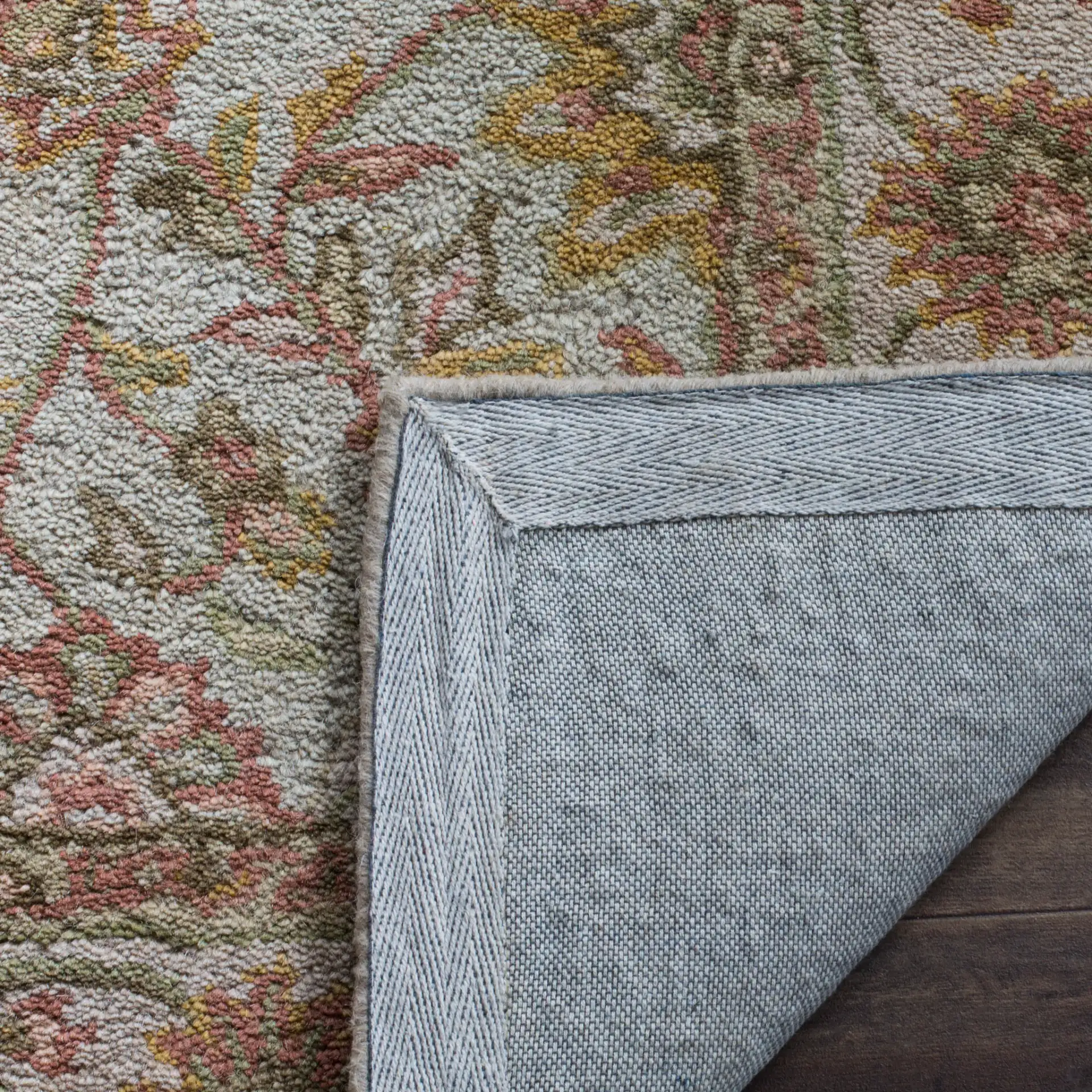Antiquity Rosette Trellis Hand-Tufted Wool Rug in Ivory / Light Green in a styled room