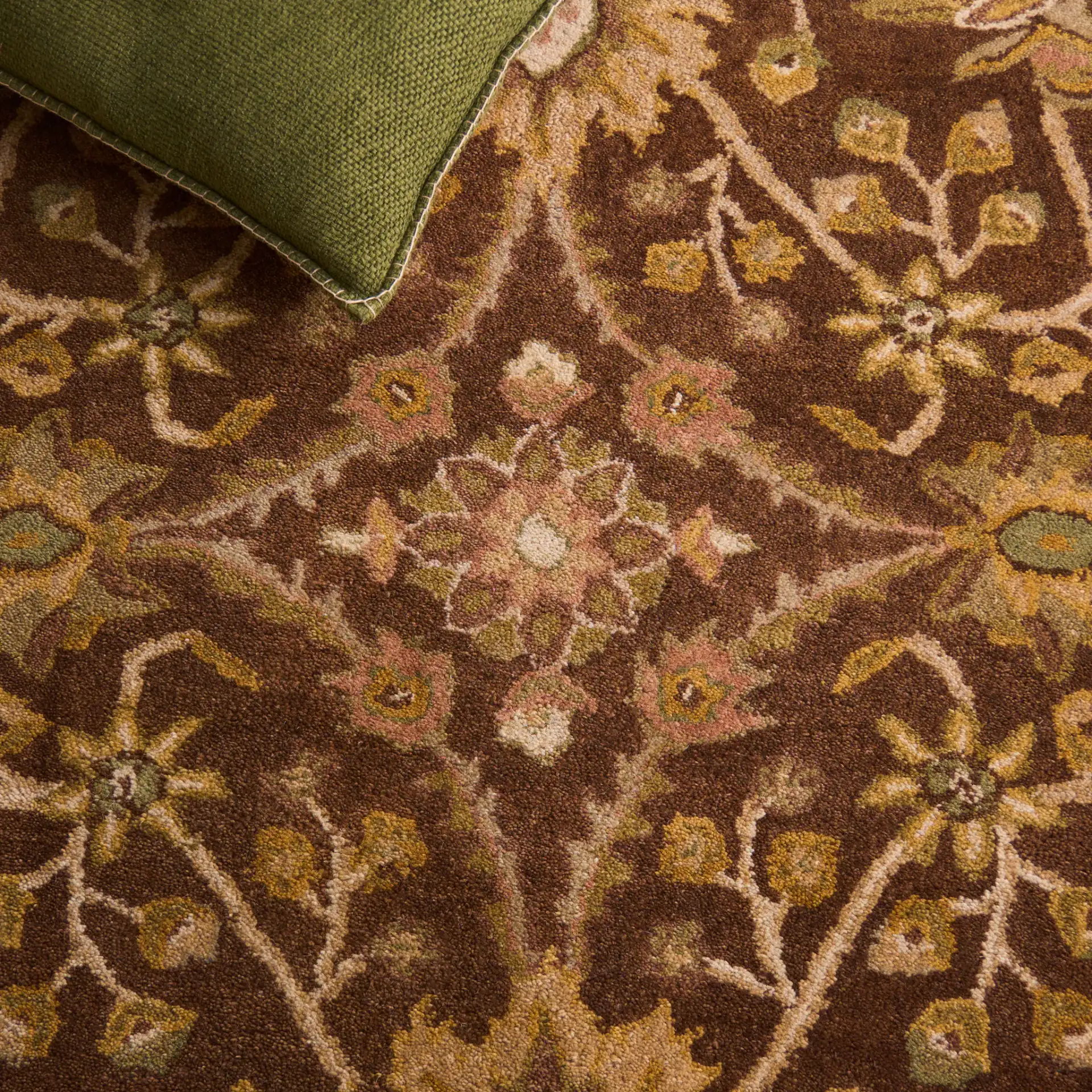 Antiquity Palmette Bordered Hand-Tufted Wool Rug in Chocolate / Blue in a styled room