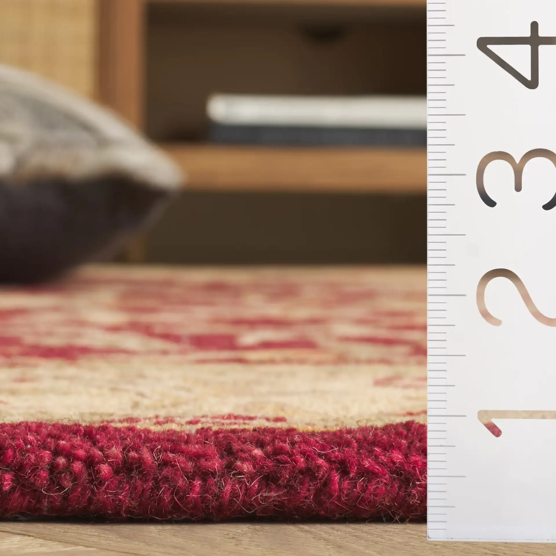 Antiquity Floral Border Hand-Tufted Wool Rug in Red / Gold in a styled room