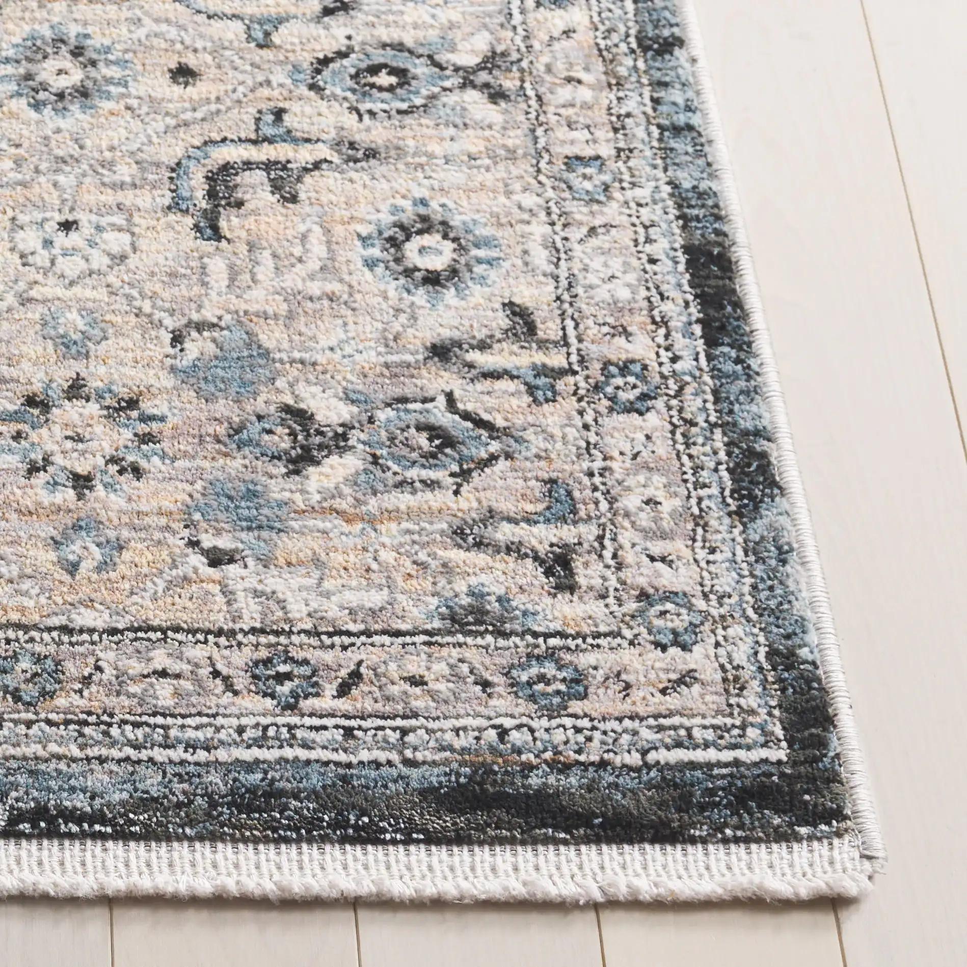 Artifact Hexagonal Medallion Rug in Gray / Black in a styled room
