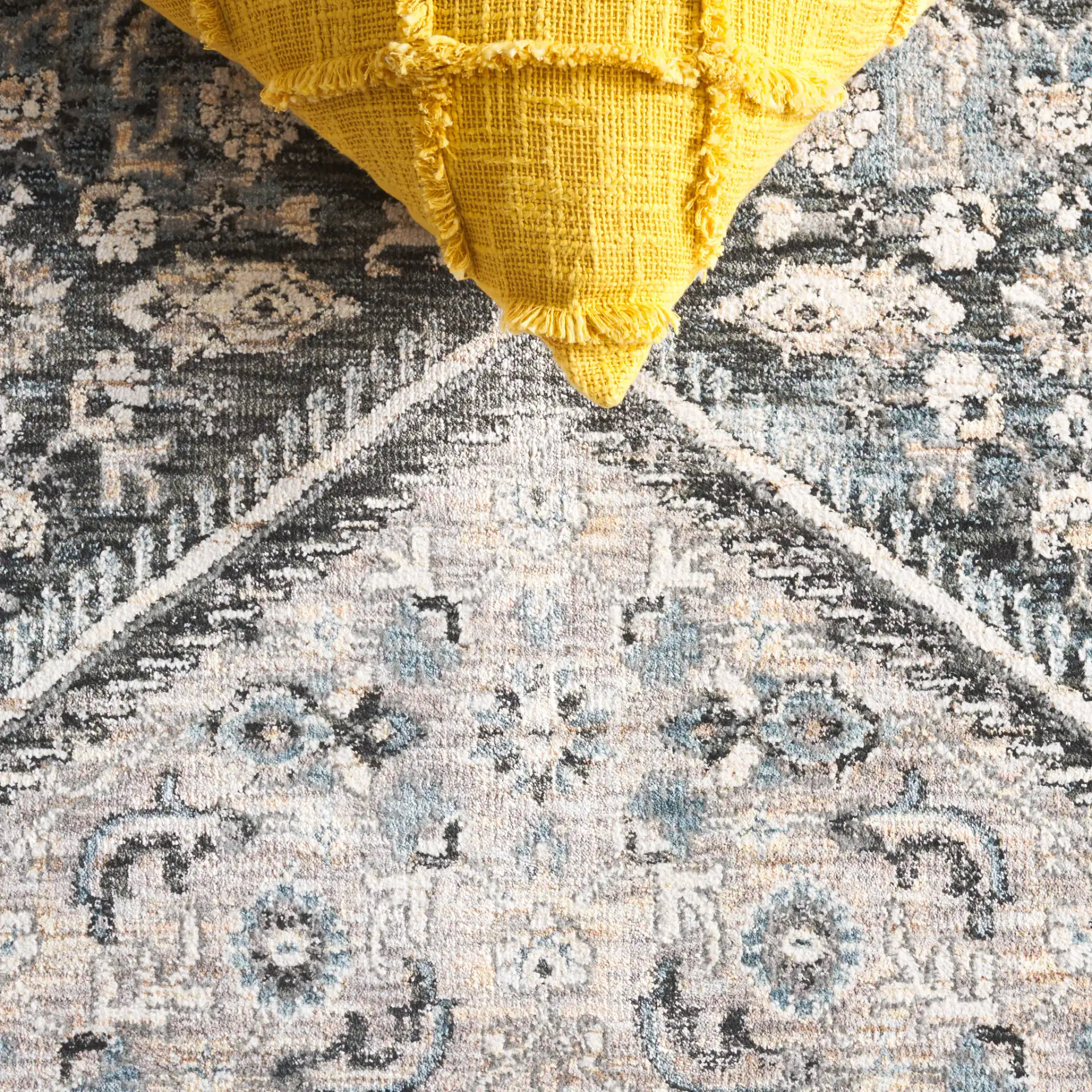 Artifact Hexagonal Medallion Rug in Gray / Black in a styled room