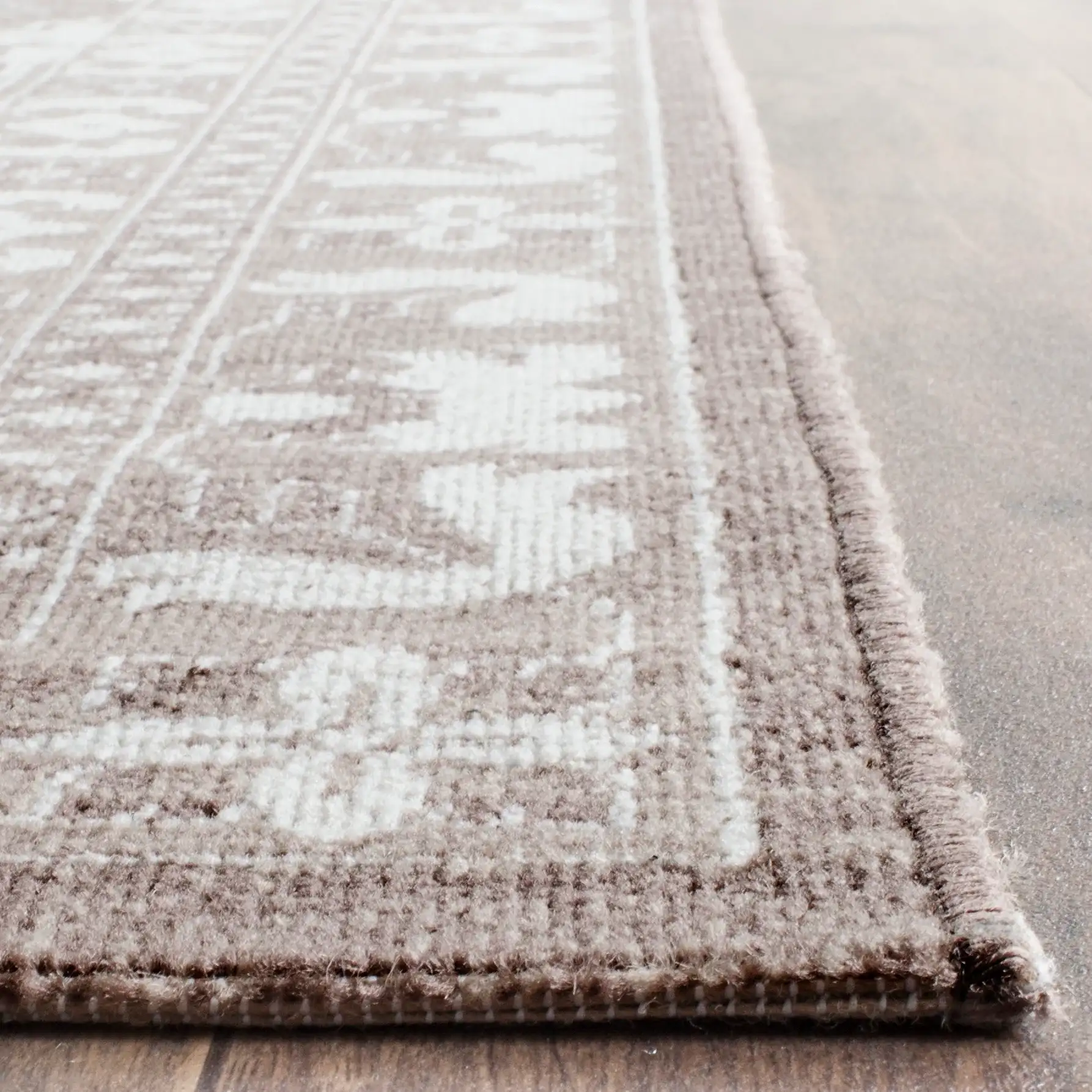 Artisan Tile Rug in Brown / Ivory in a styled room