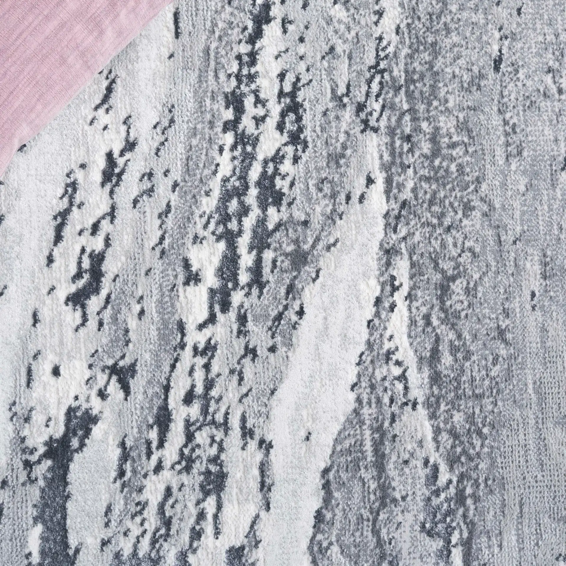 Aura Marble Abstract Rug in Ivory / Dark Gray in a styled room