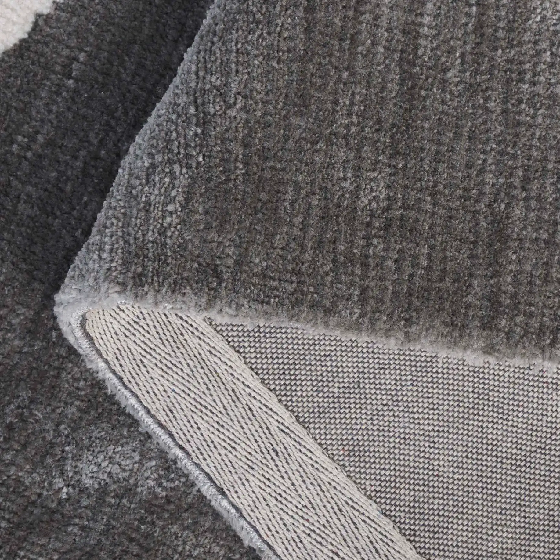 Audrey Abstract Block Rug in Gray / Ivory in a styled room