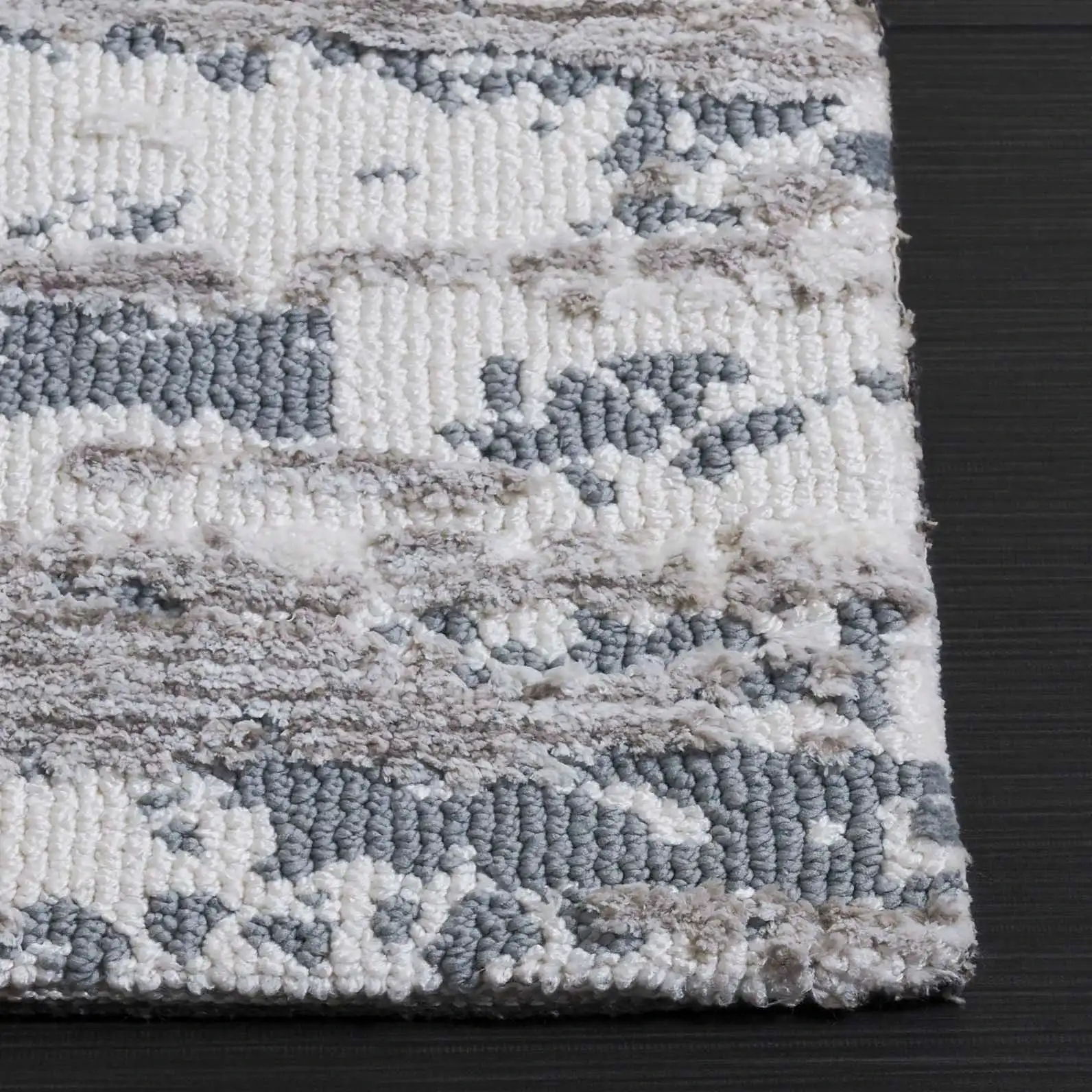 Audrey Striated Abstract Rug in Gray / Beige in a styled room