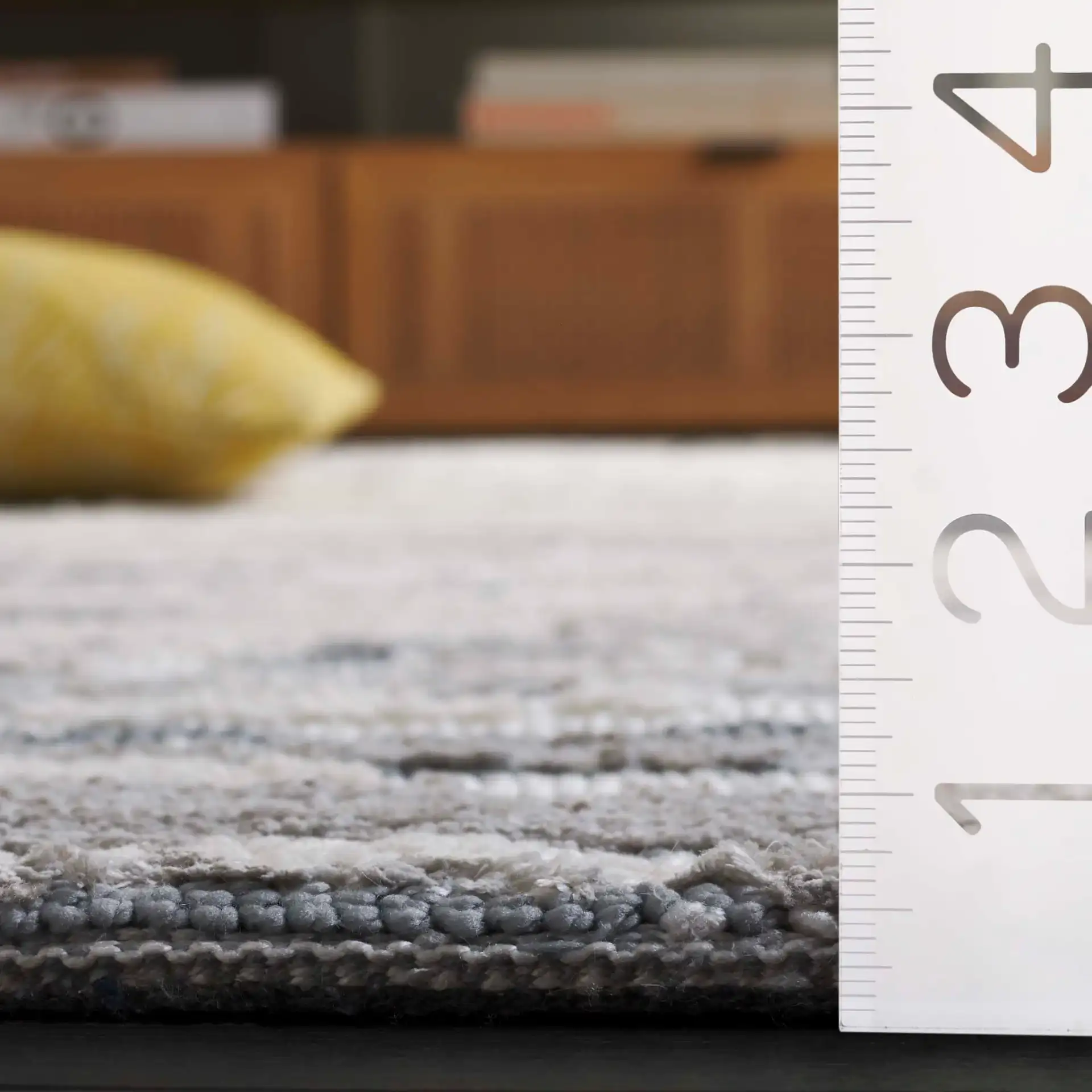 Audrey Striated Abstract Rug in Gray / Beige in a styled room