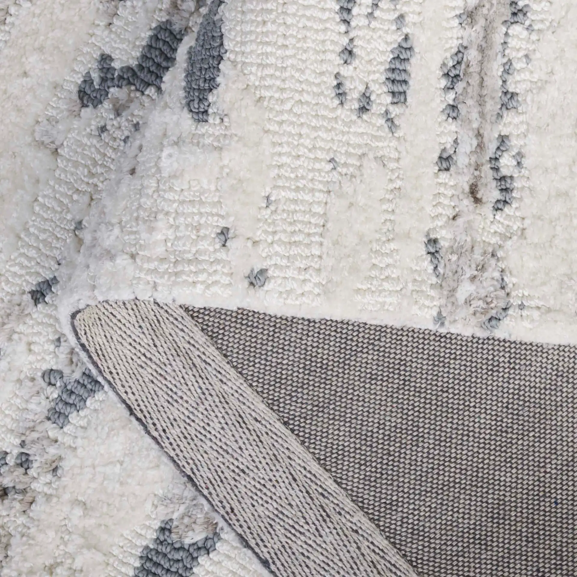 Audrey Striated Abstract Rug in Gray / Beige in a styled room