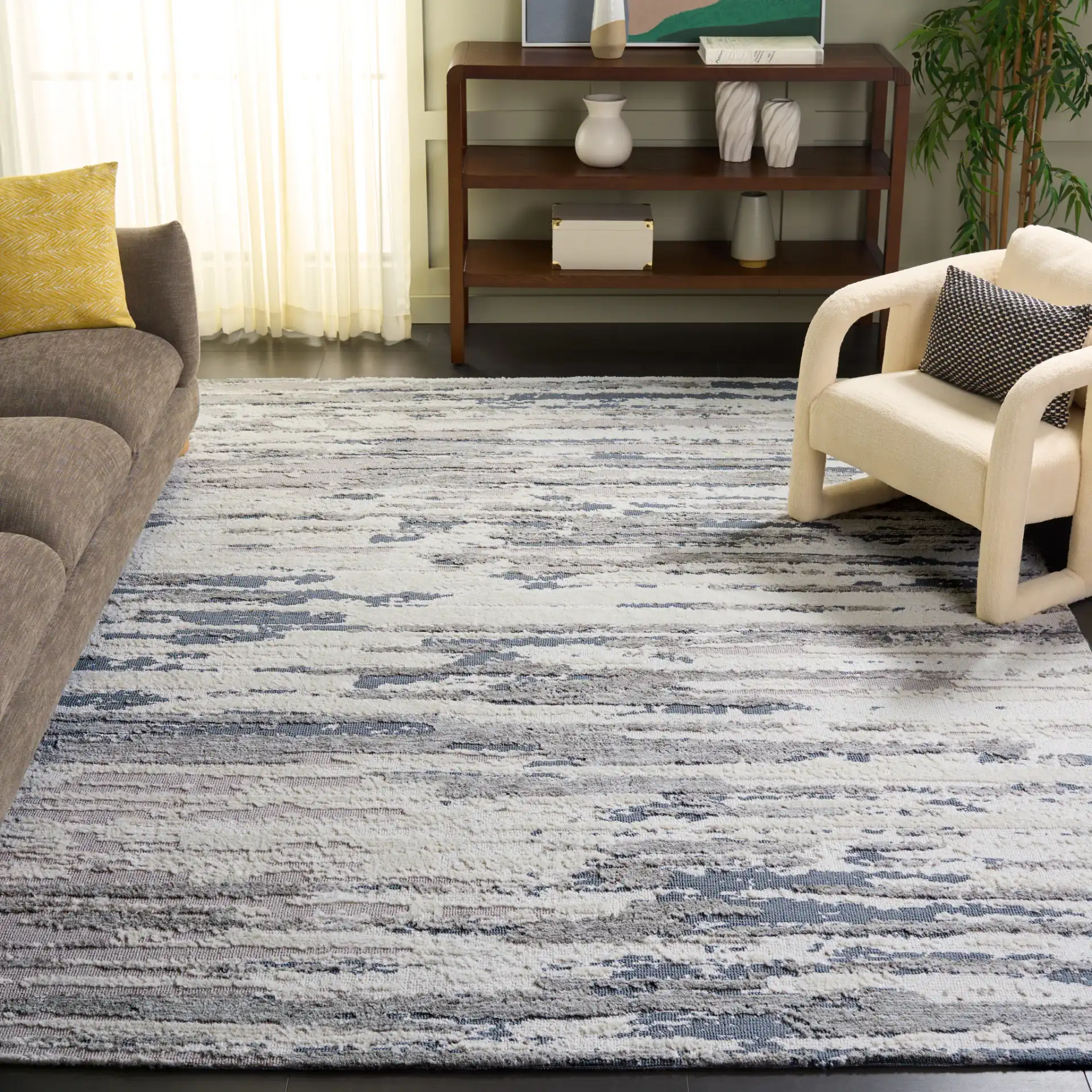 Audrey Striated Abstract Rug in Gray / Beige in a styled room