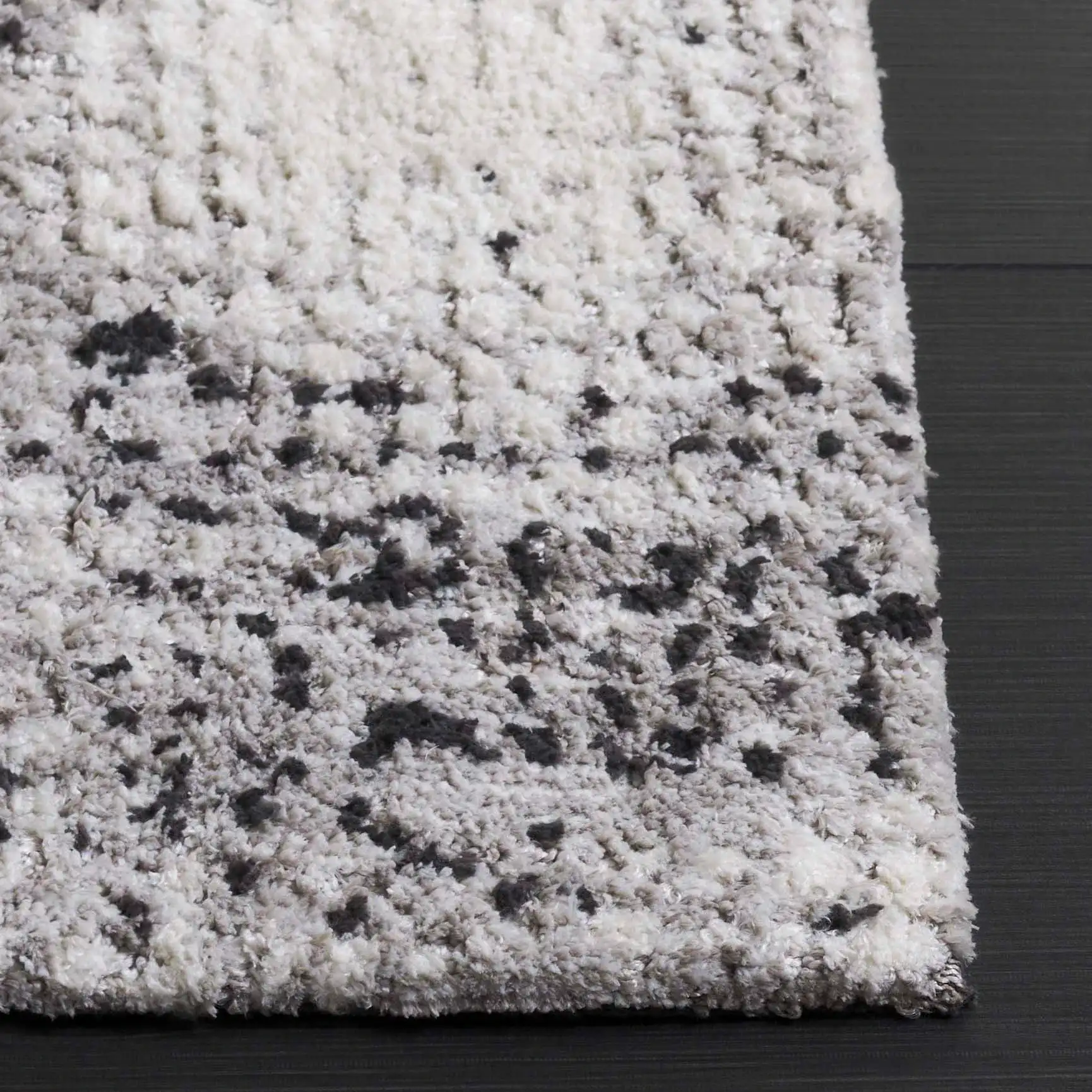 Audrey Abstract Circles Rug in Gray / Ivory in a styled room