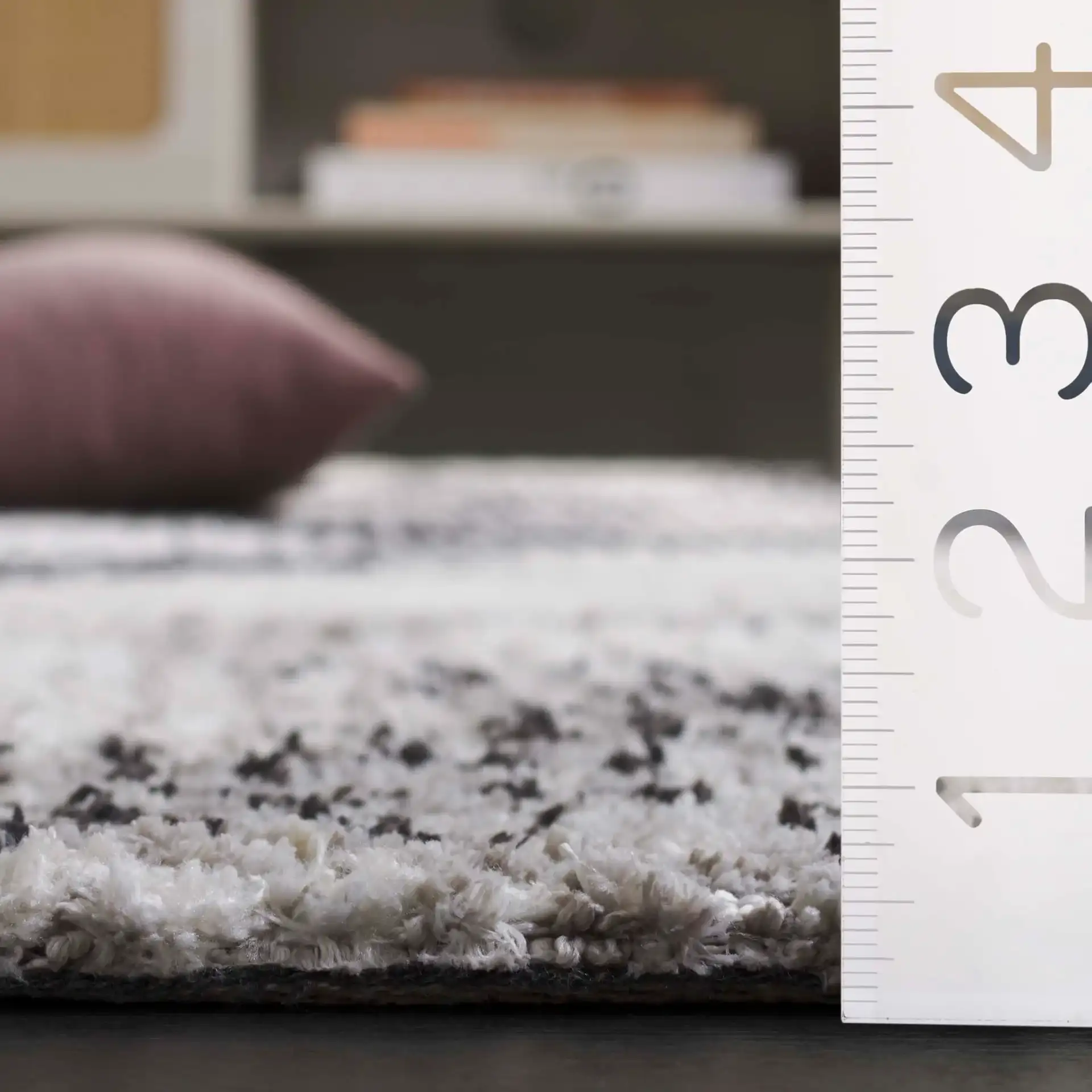 Audrey Abstract Circles Rug in Gray / Ivory in a styled room