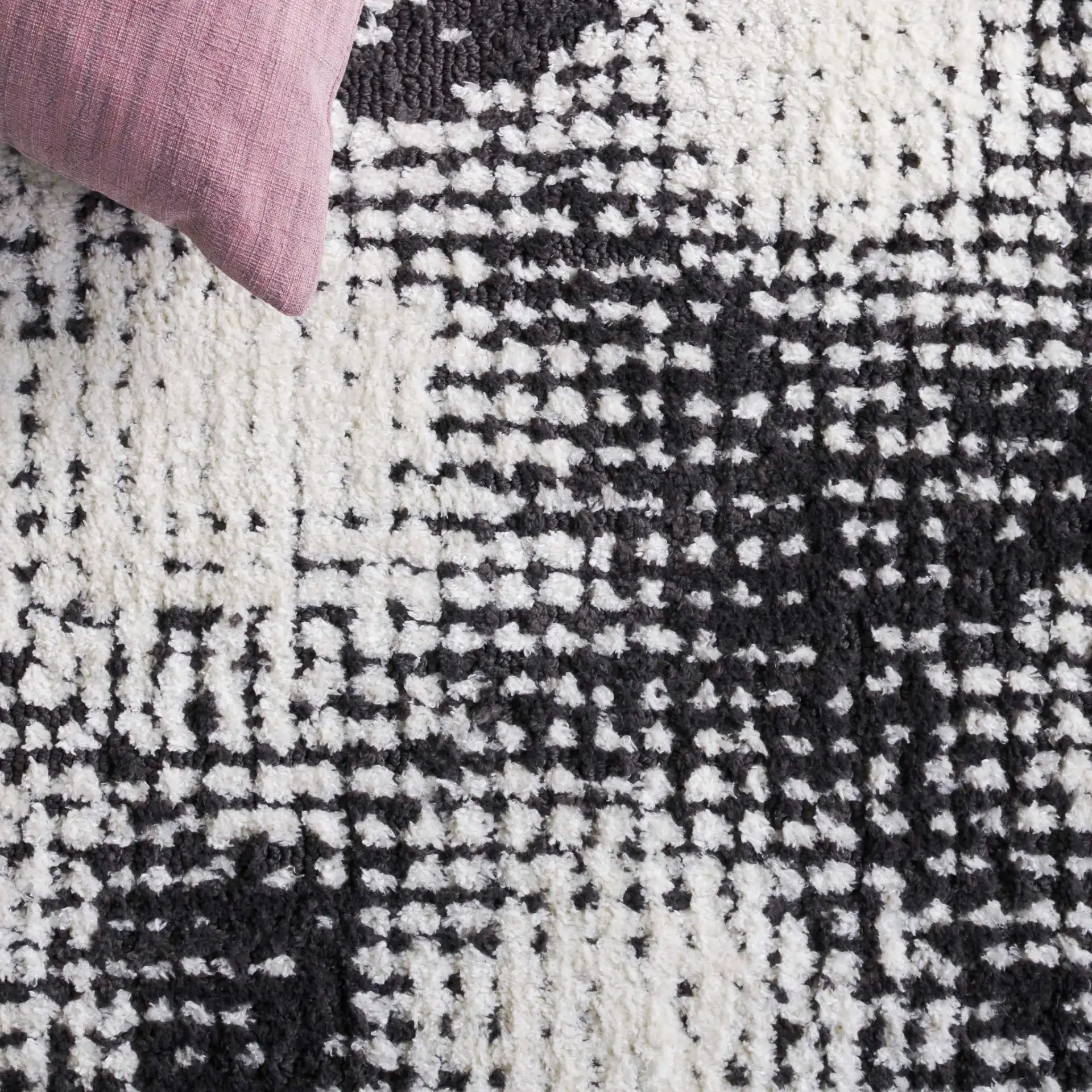 Audrey Abstract Circles Rug in Gray / Ivory in a styled room
