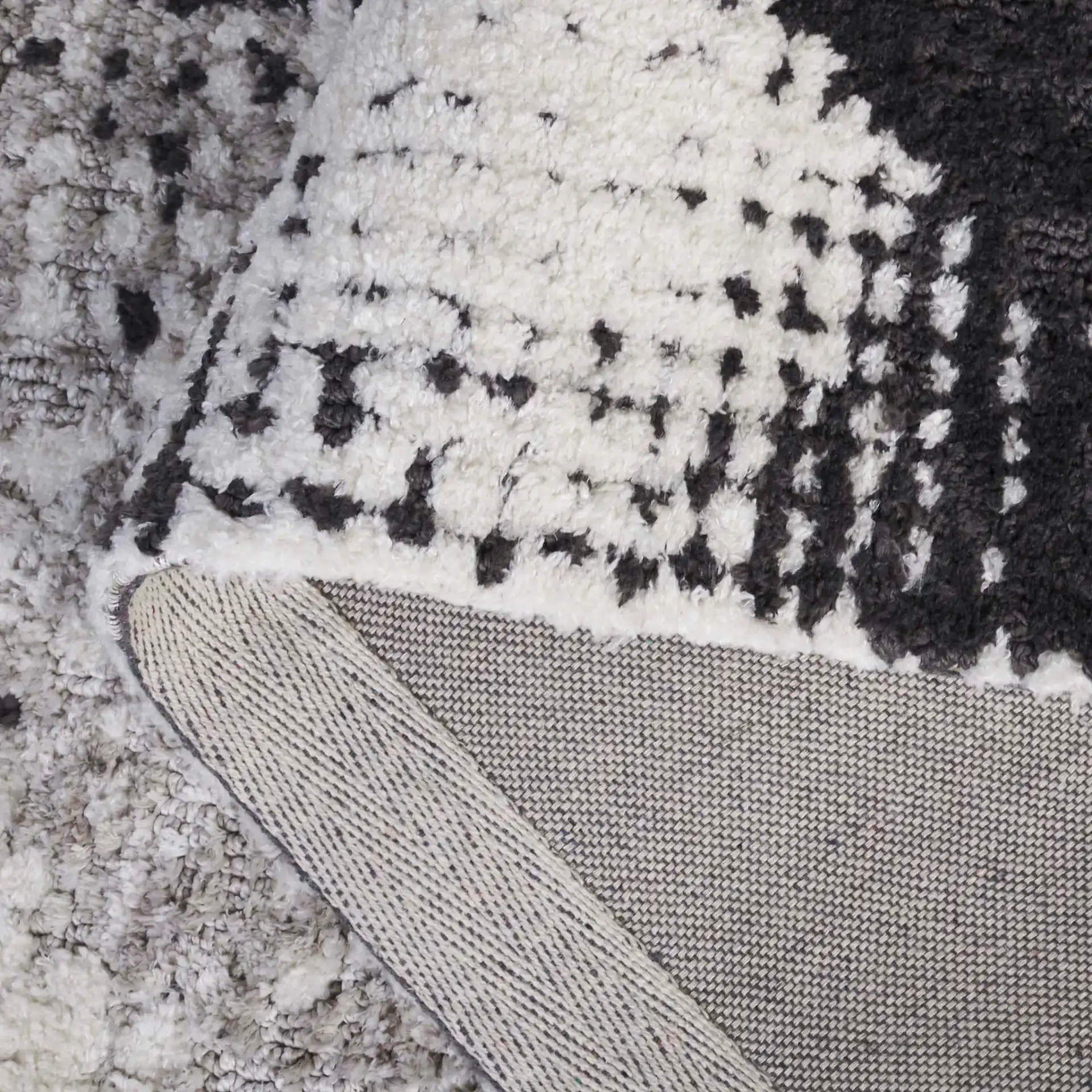 Audrey Abstract Circles Rug in Gray / Ivory in a styled room