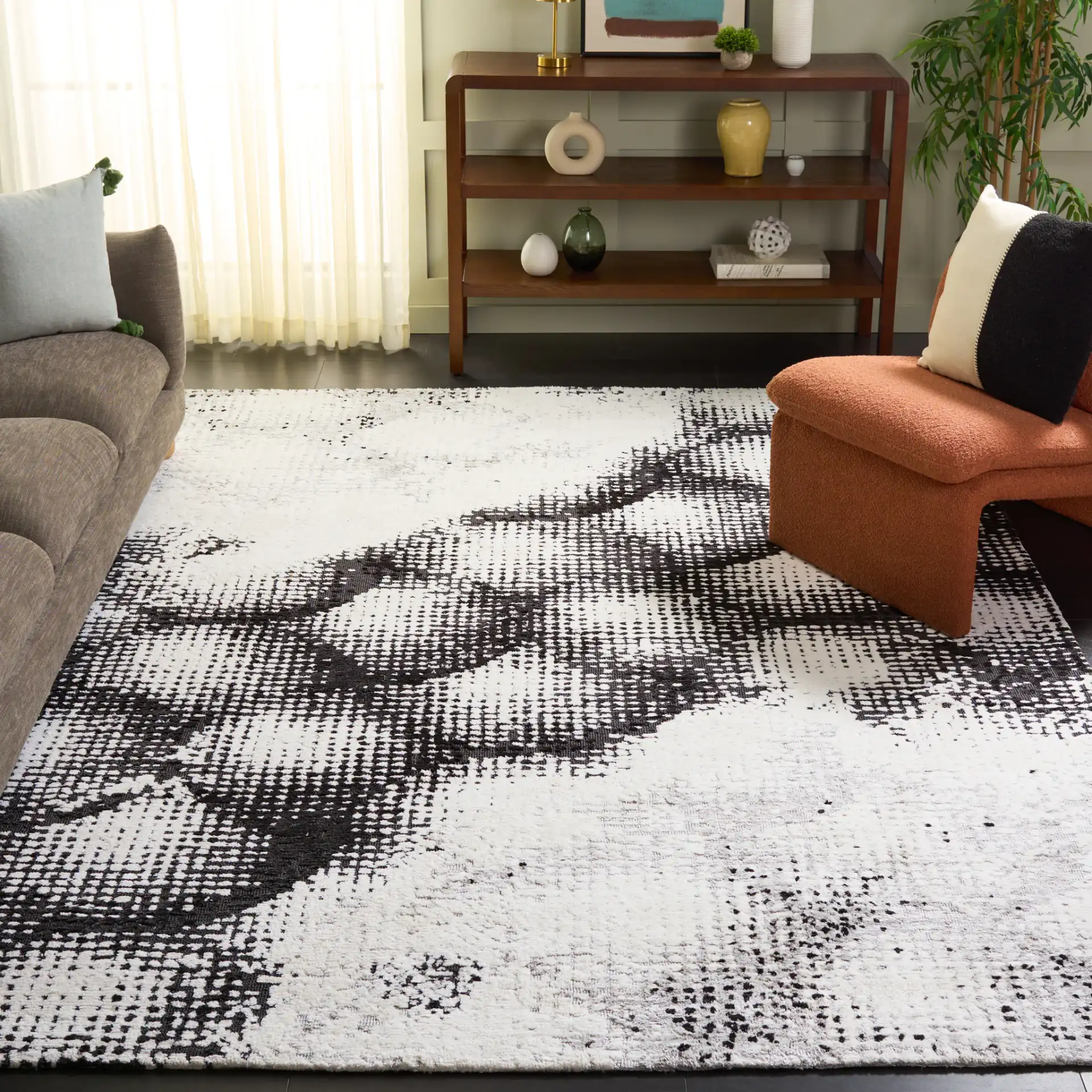 Audrey Abstract Circles Rug in Gray / Ivory in a styled room