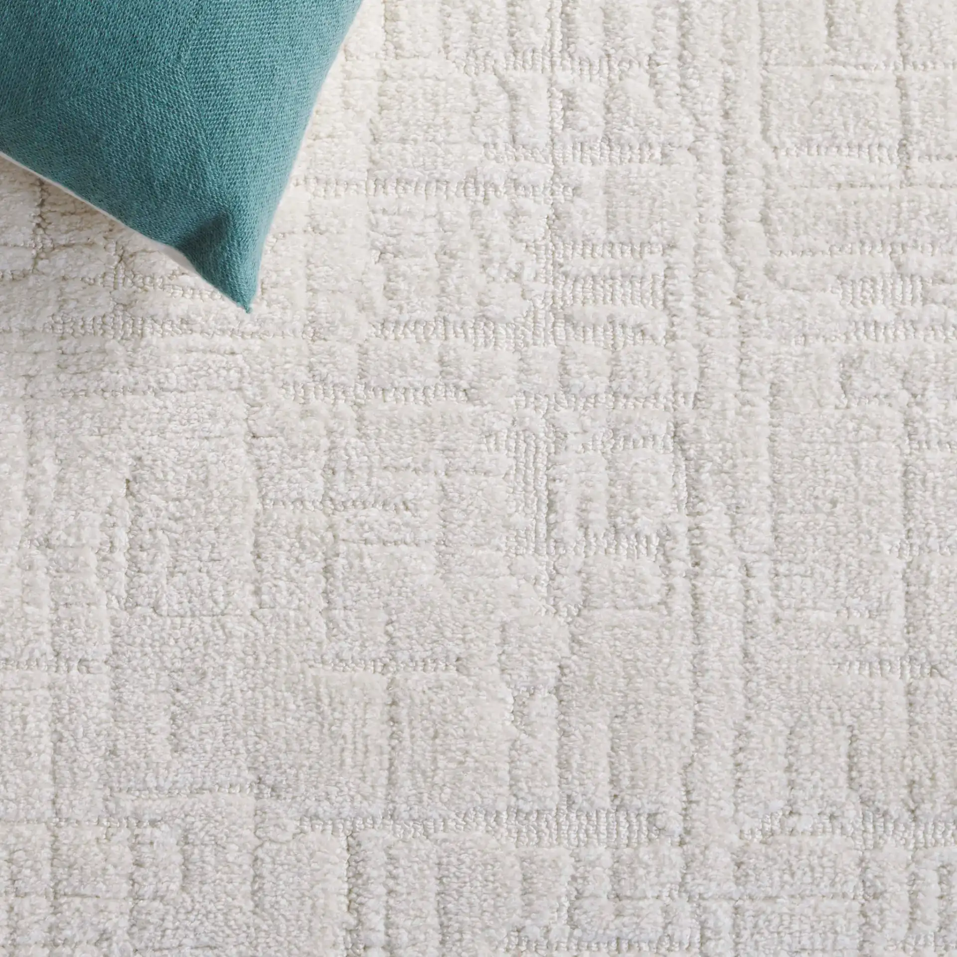 Audrey Textured Grid Rug in Ivory in a styled room