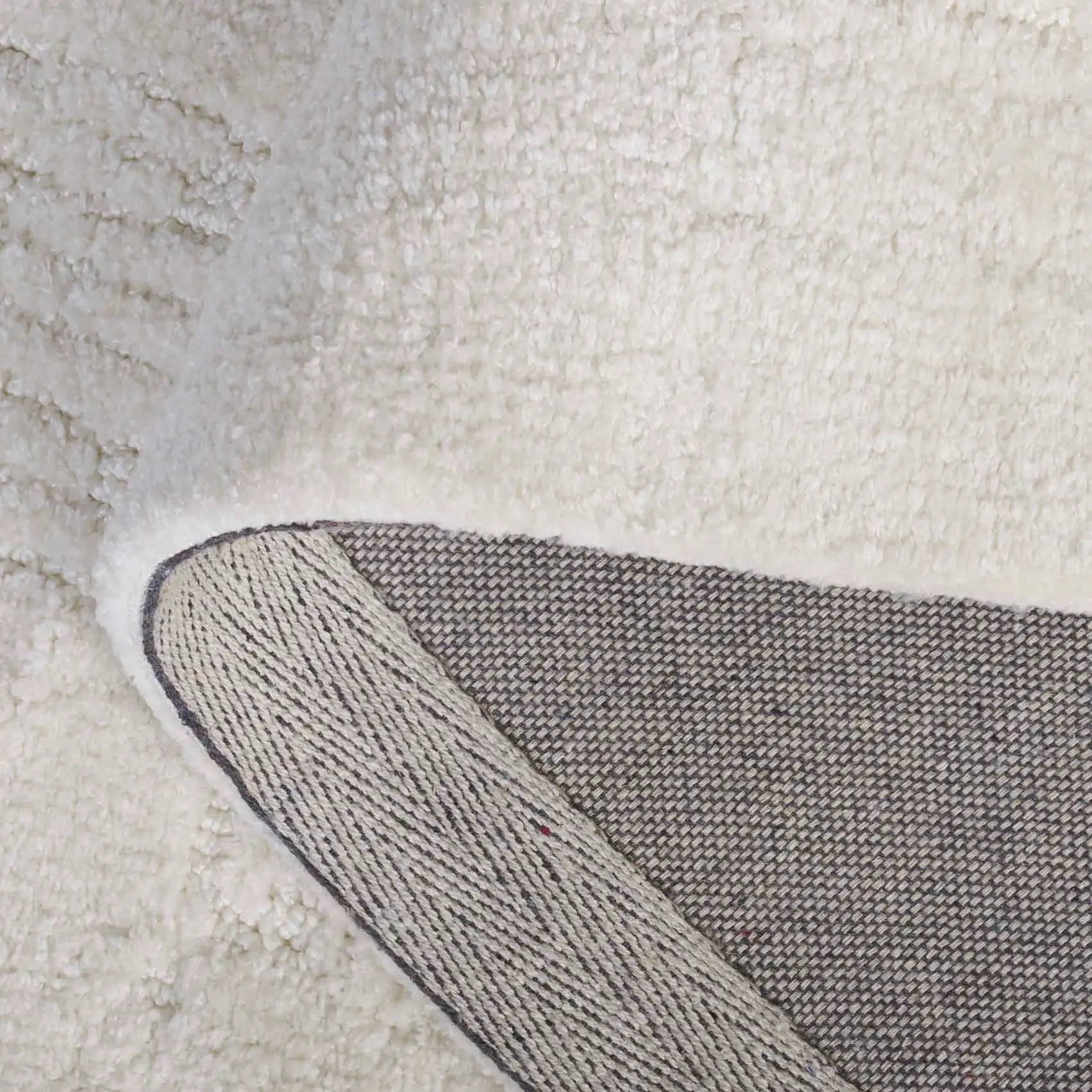 Audrey Textured Grid Rug in Ivory in a styled room