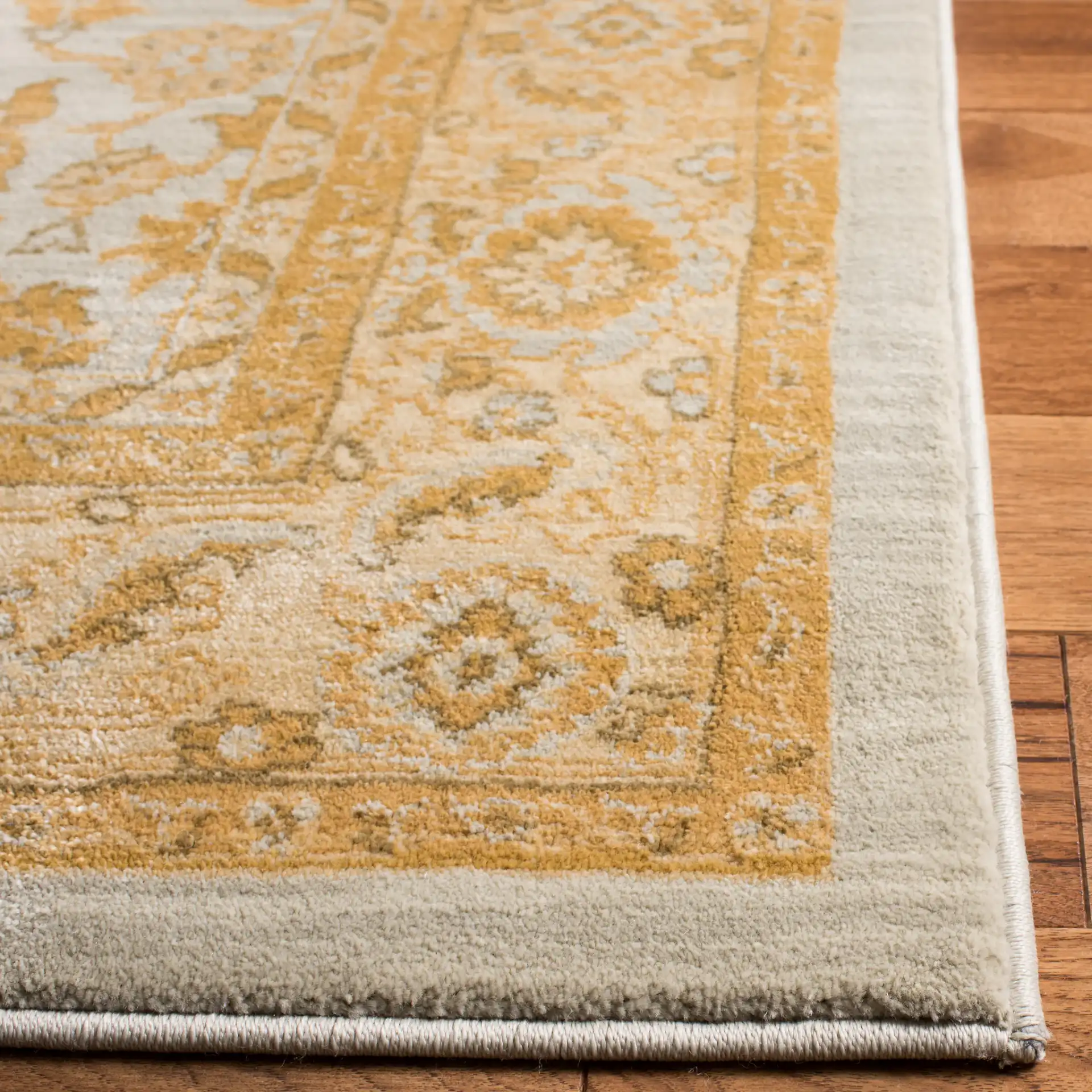 Austin Marcus Rug in Light Blue / Gold in a styled room