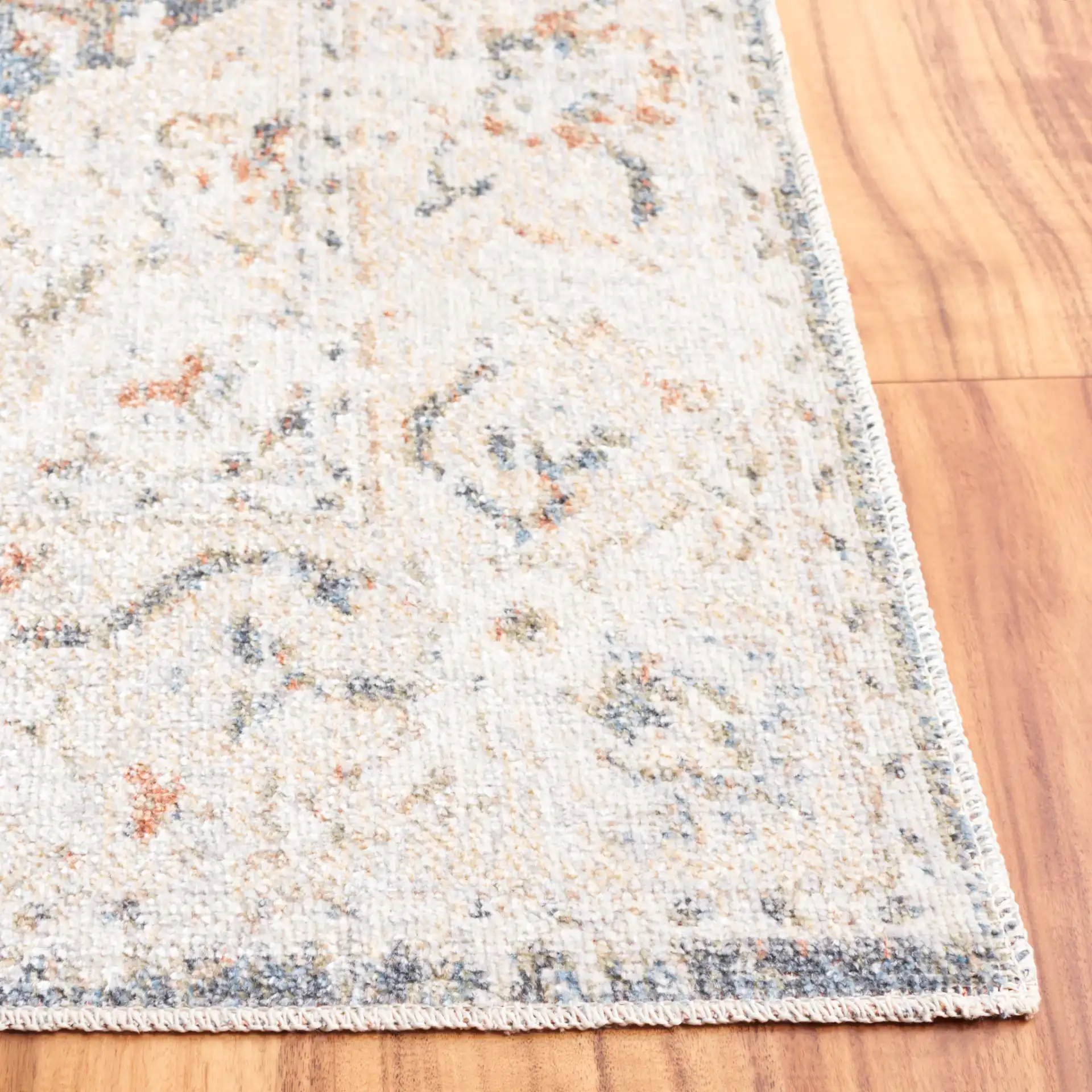 Baltimore Faded Medallion Washable Rug in Light Gray / Blue in a styled room