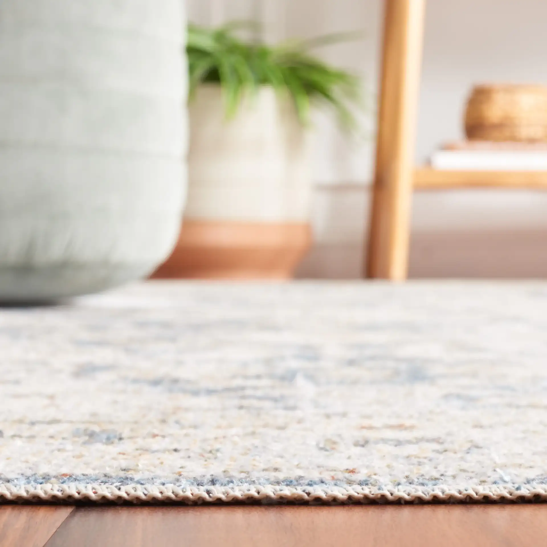 Baltimore Faded Medallion Washable Rug in Light Gray / Blue in a styled room