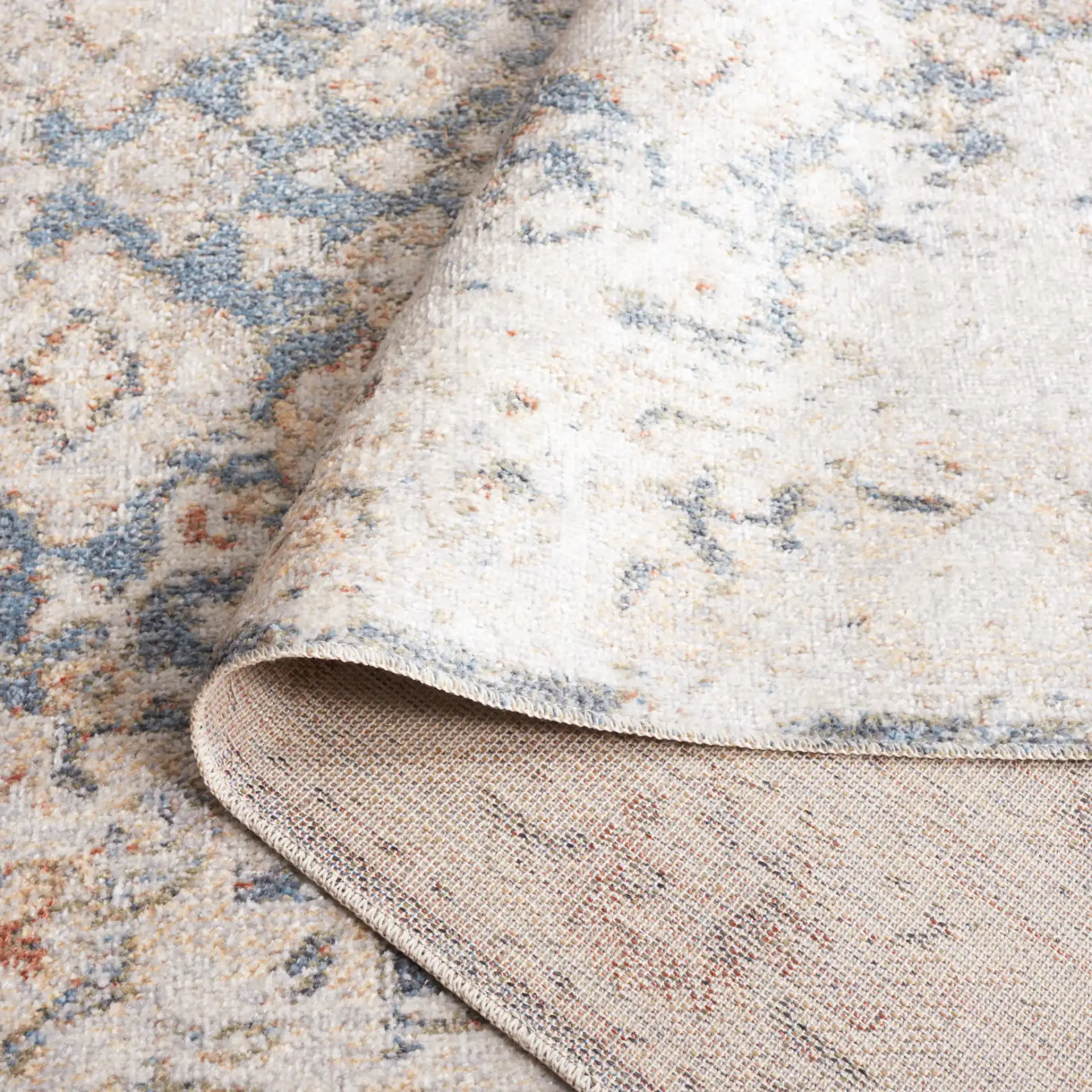 Baltimore Faded Medallion Washable Rug in Light Gray / Blue in a styled room