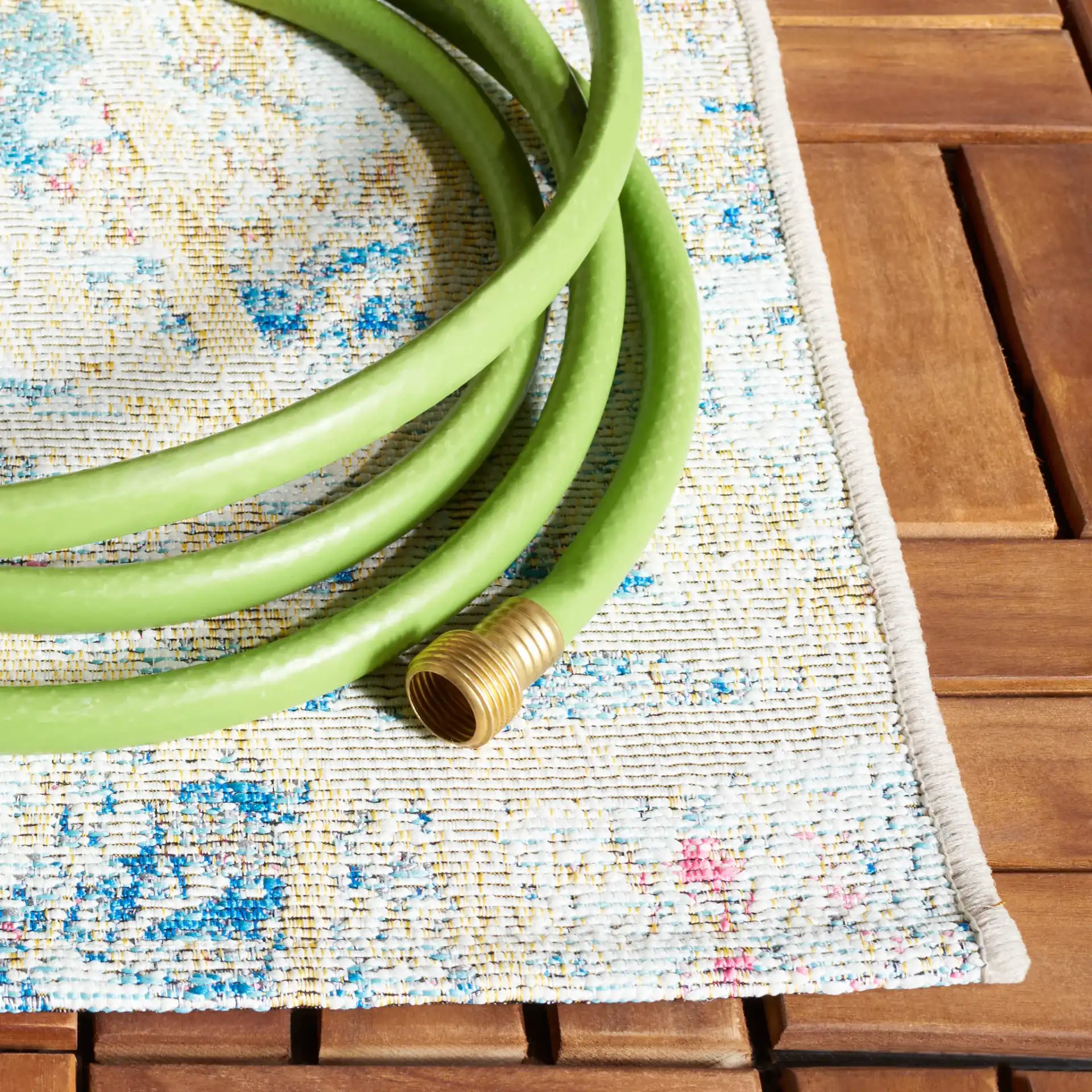 Barbados Distressed Palm Outdoor Rug in Light Blue / Ivory in a styled room