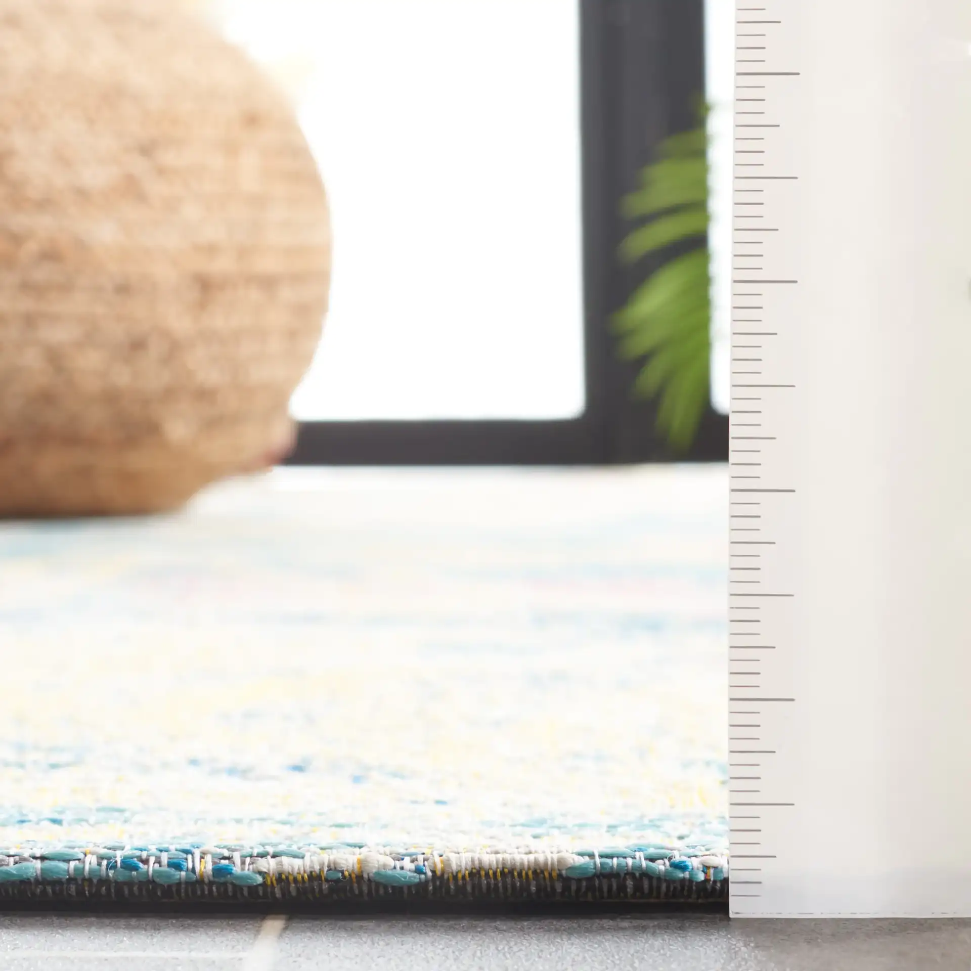Barbados Distressed Palm Outdoor Rug in Light Blue / Ivory in a styled room