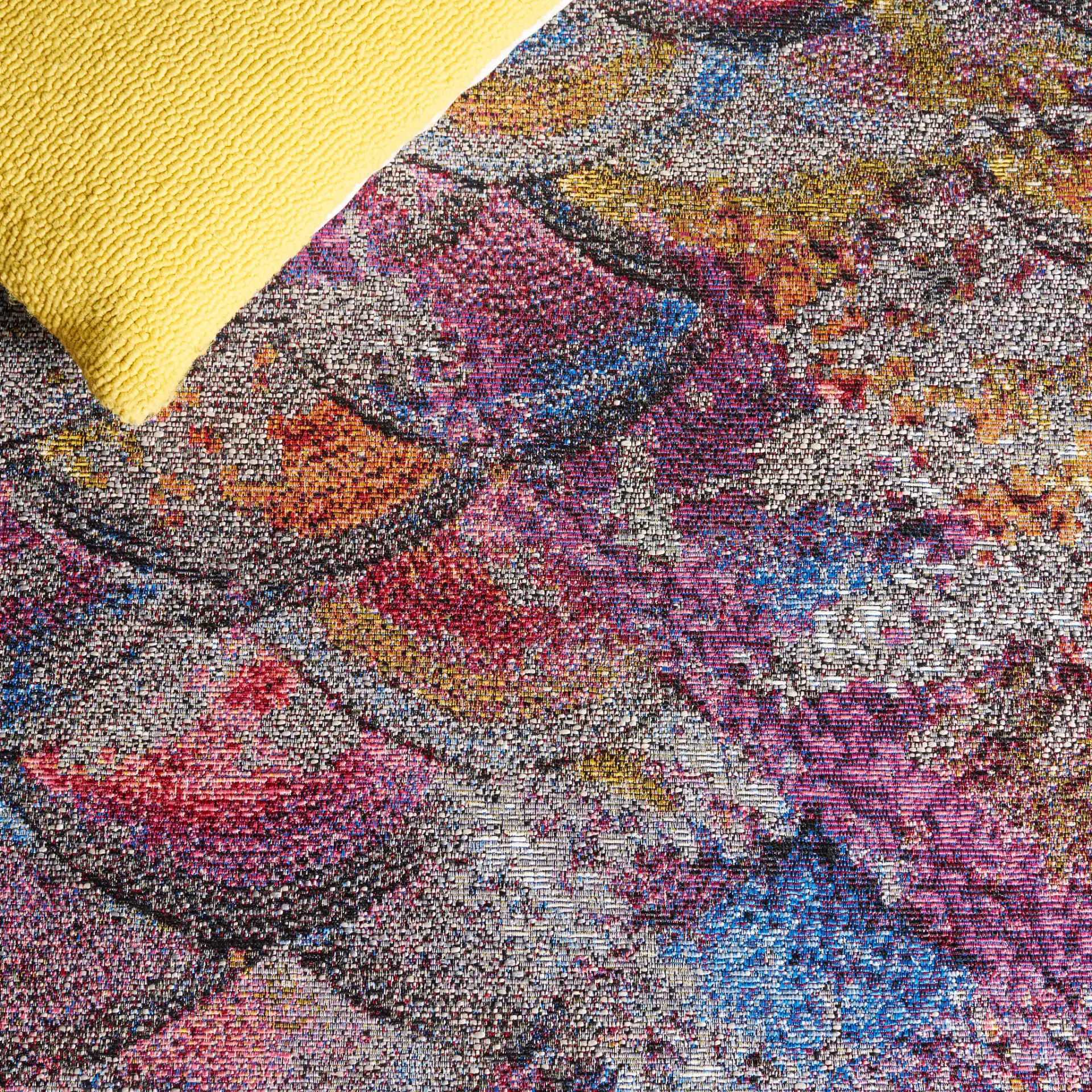 Barbados Scalloped Fan Outdoor Rug in Gray Purple / Blue Gold in a styled room