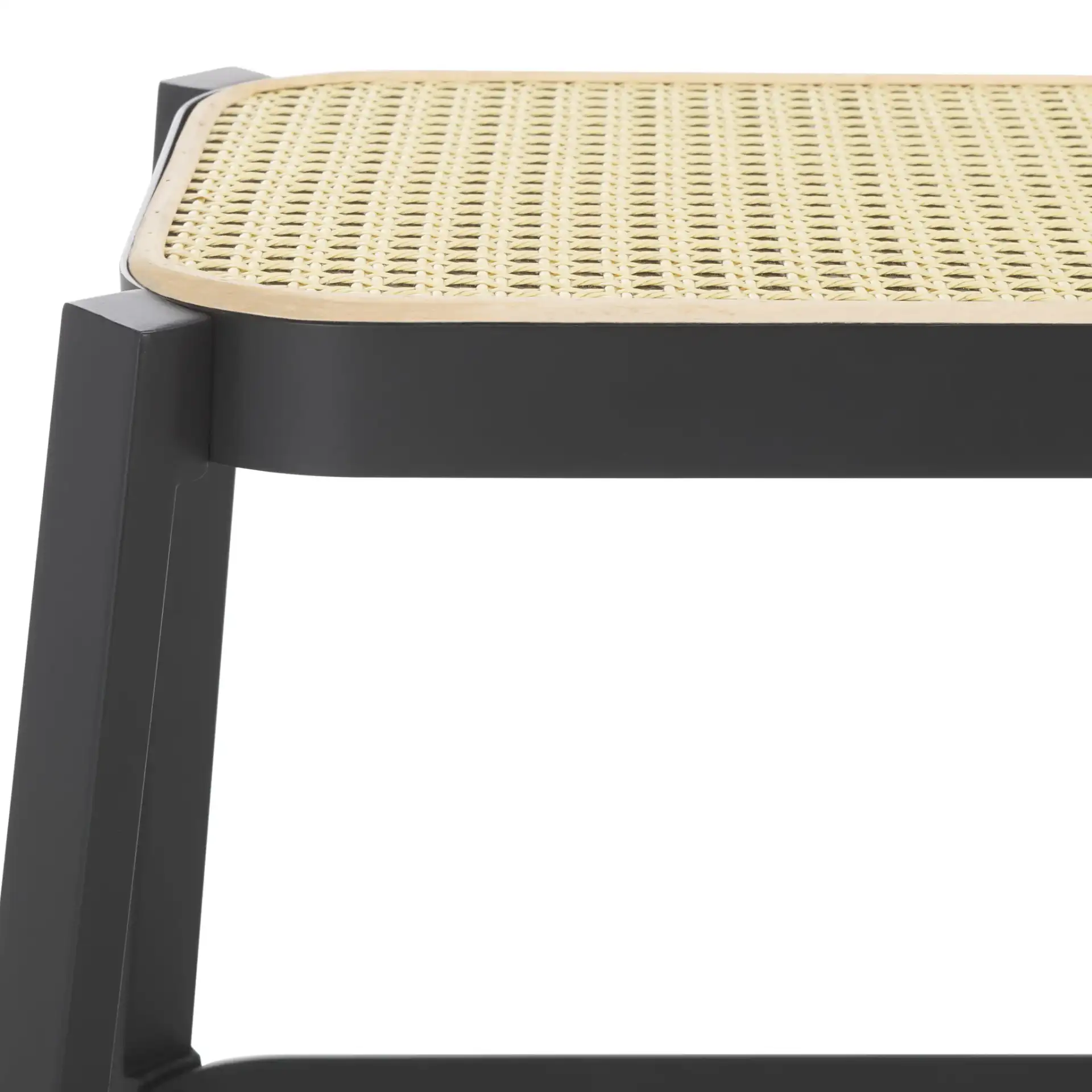 Jaguar Cane Bench in Black / Natural in a styled room