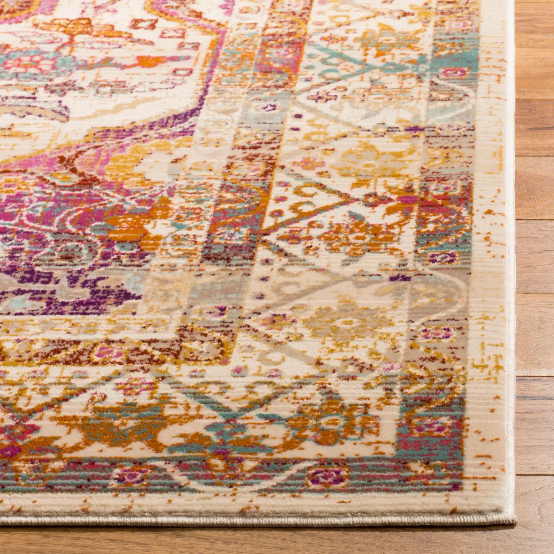 Baldwin Medallion Bordered Rug in Ivory / Fuchsia in a styled room