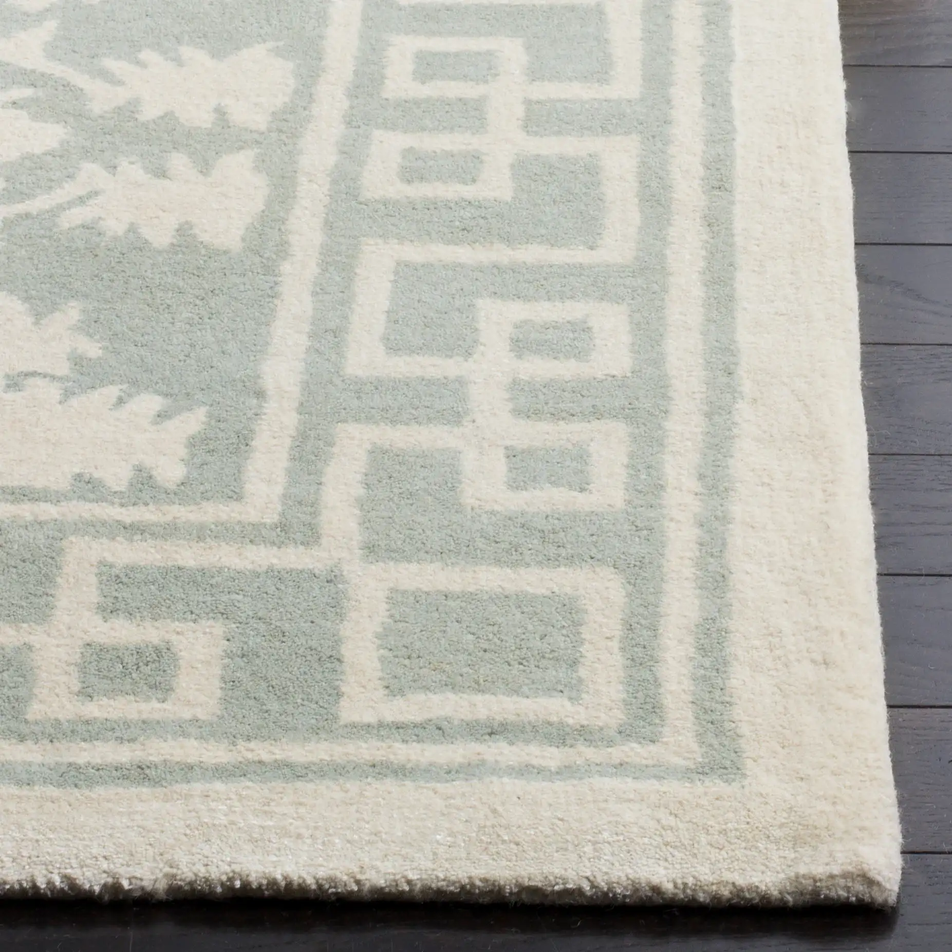 Bella Floral Greek Key Hand-Tufted Wool Rug in Gray / Ivory in a styled room