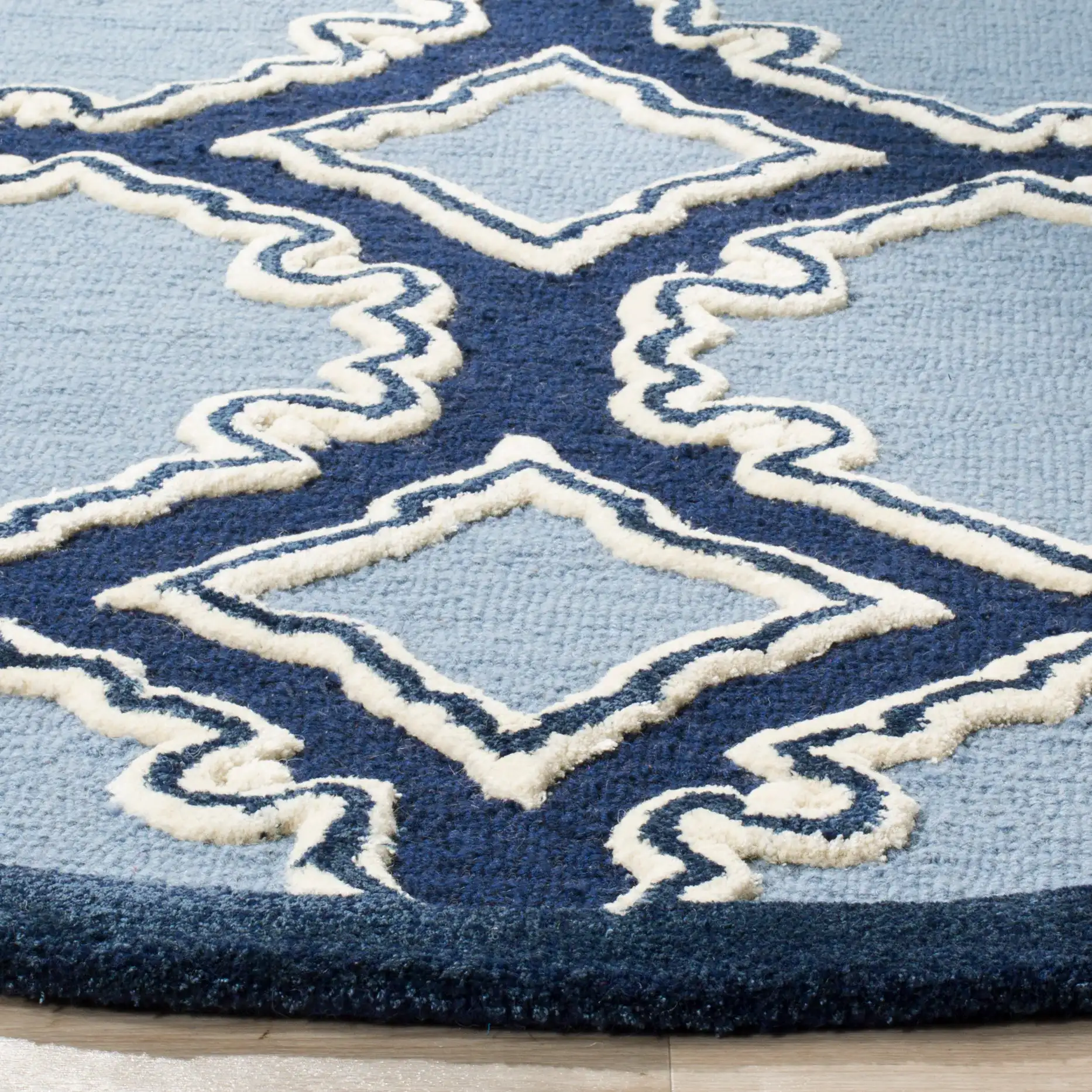 Bella Scalloped Trellis Hand-Tufted Wool Rug in Navy / Blue in a styled room