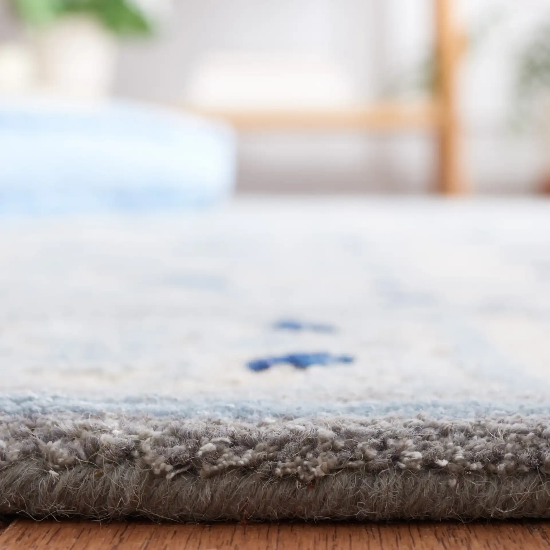 Bella Interlocking Trellis Hand-Tufted Rug in Ivory / Blue in a styled room