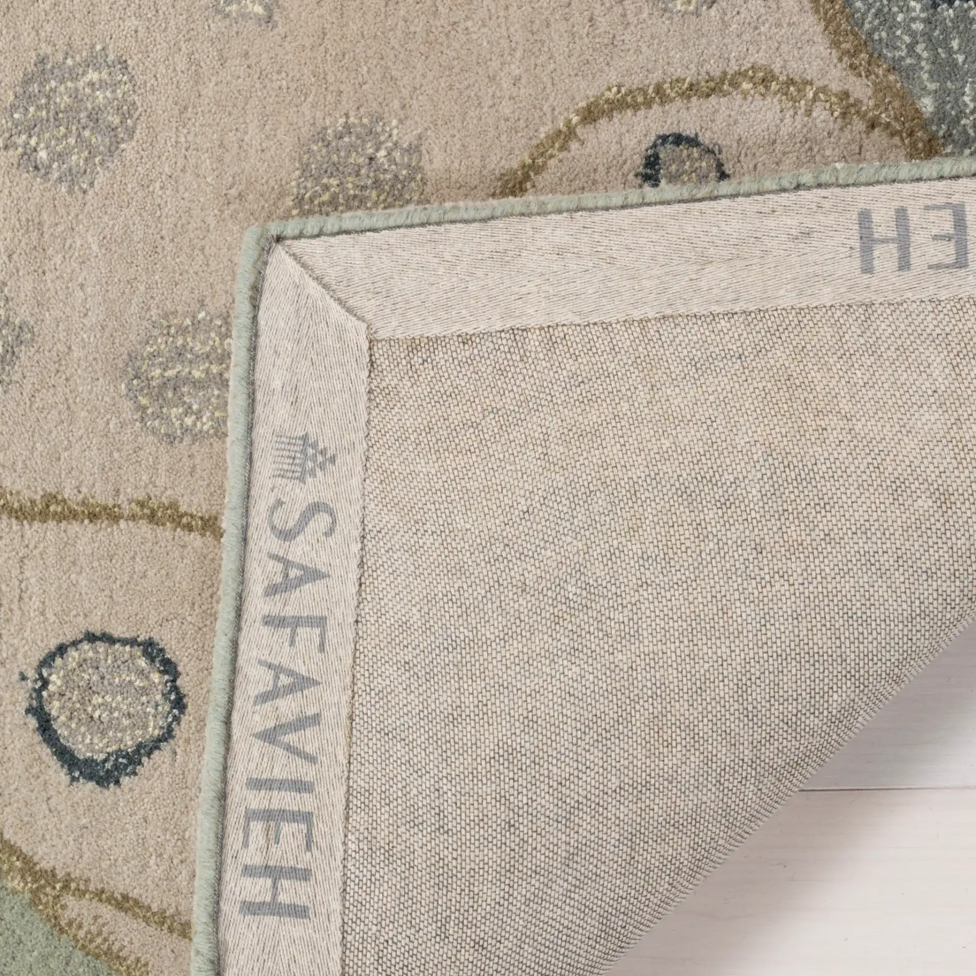 Bella Spiral Wave Hand-Tufted Wool Rug in Sage / Multicolor in a styled room