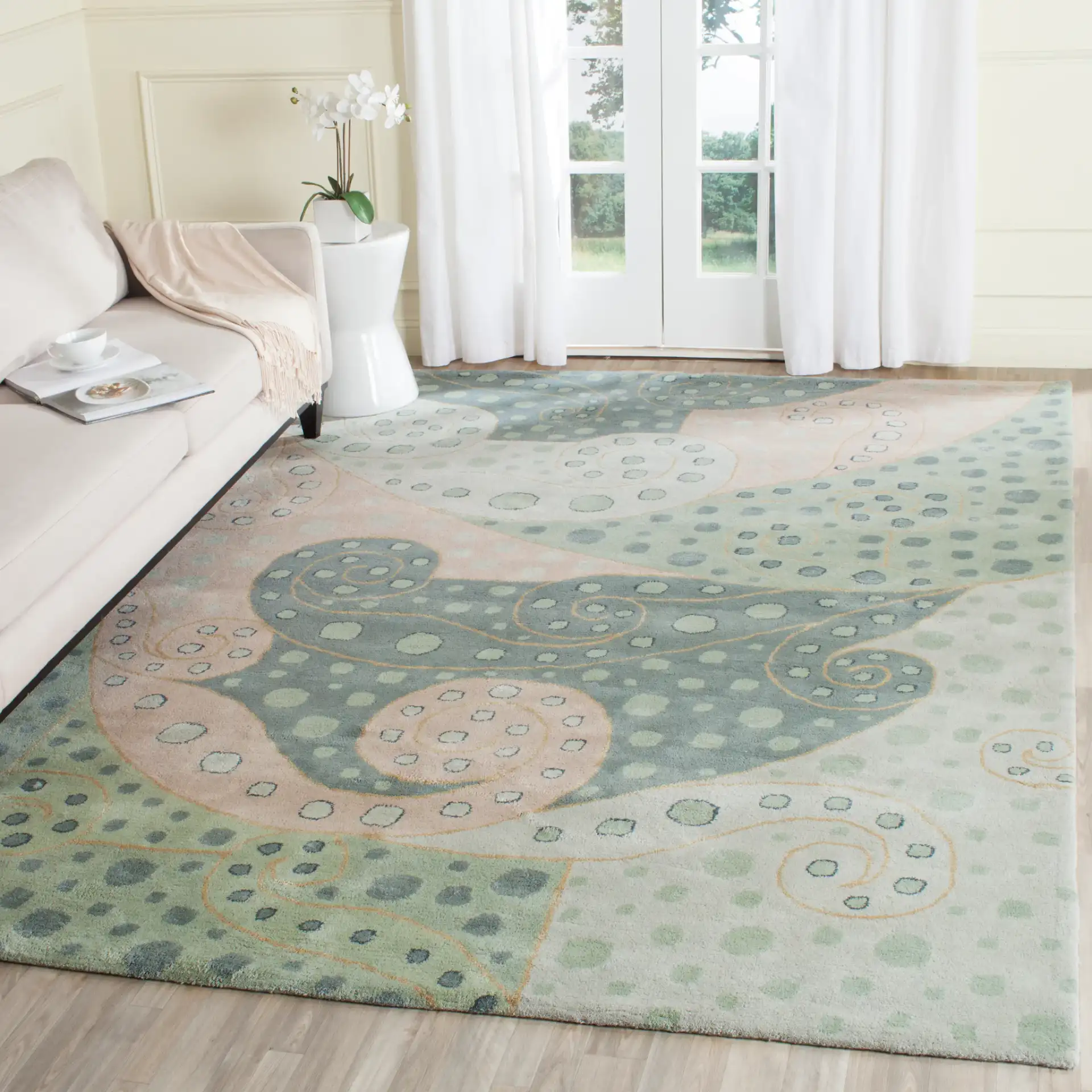 Bella Spiral Wave Hand-Tufted Wool Rug in Sage / Multicolor in a styled room