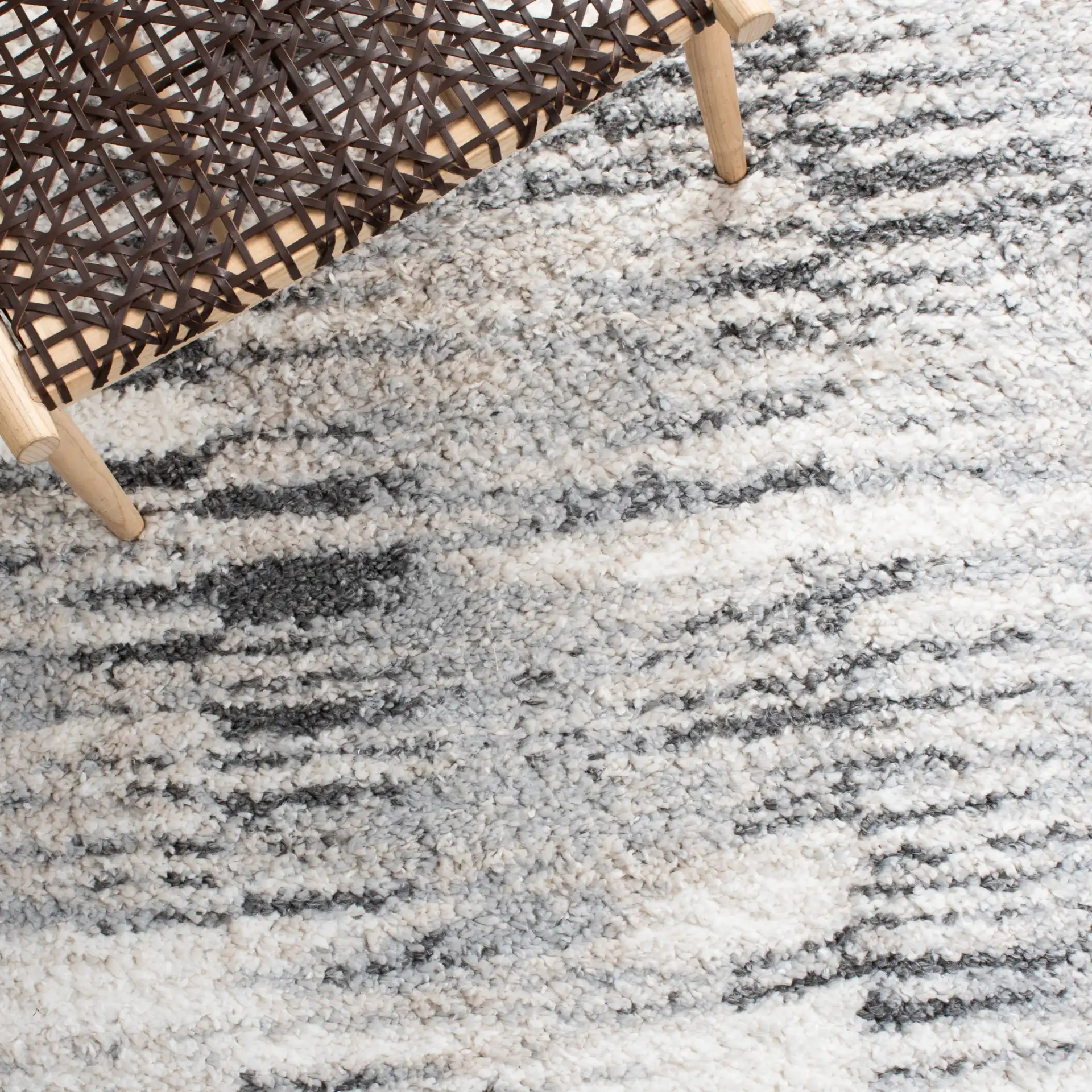 Berber Linear Stripe Shag Rug in Gray / Ivory in a styled room
