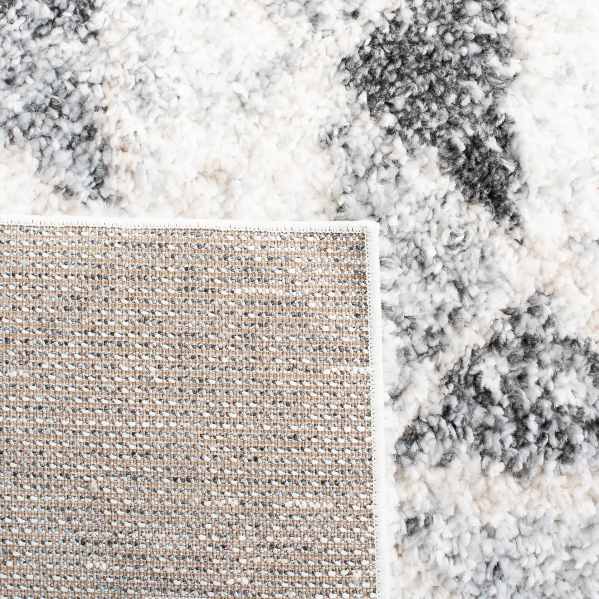Berber Triangle Shag Rug in Gray / Ivory in a styled room