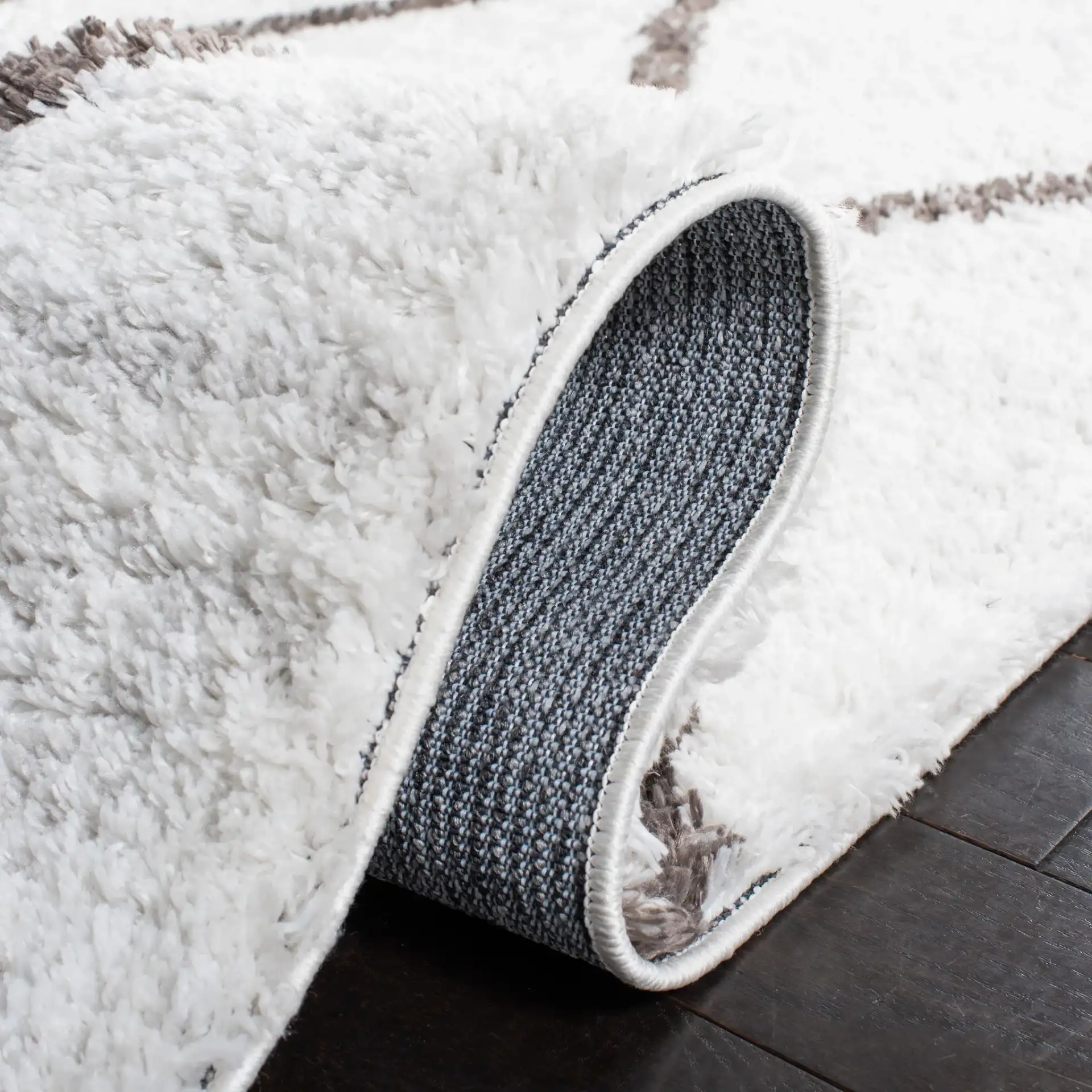 Berber Oversized Diamond Trellis Shag Rug in Ivory / Gray in a styled room