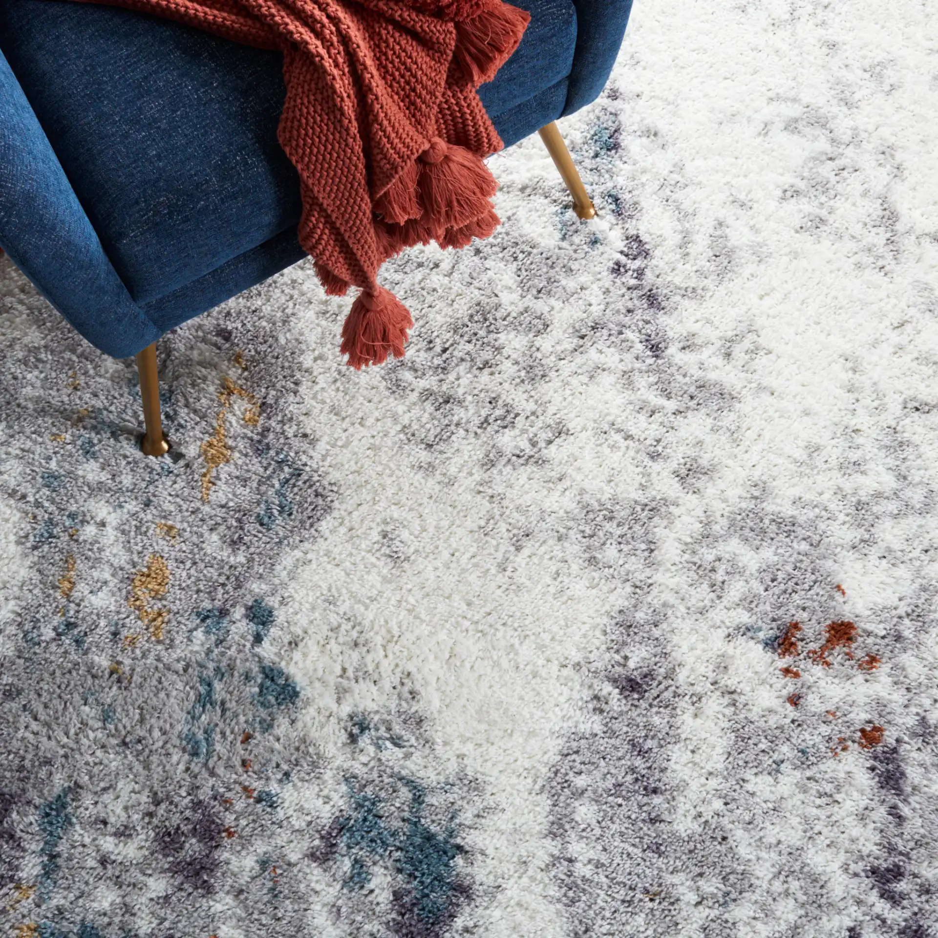Berber Mottled Shag Rug in Blue Rust / Ivory in a styled room