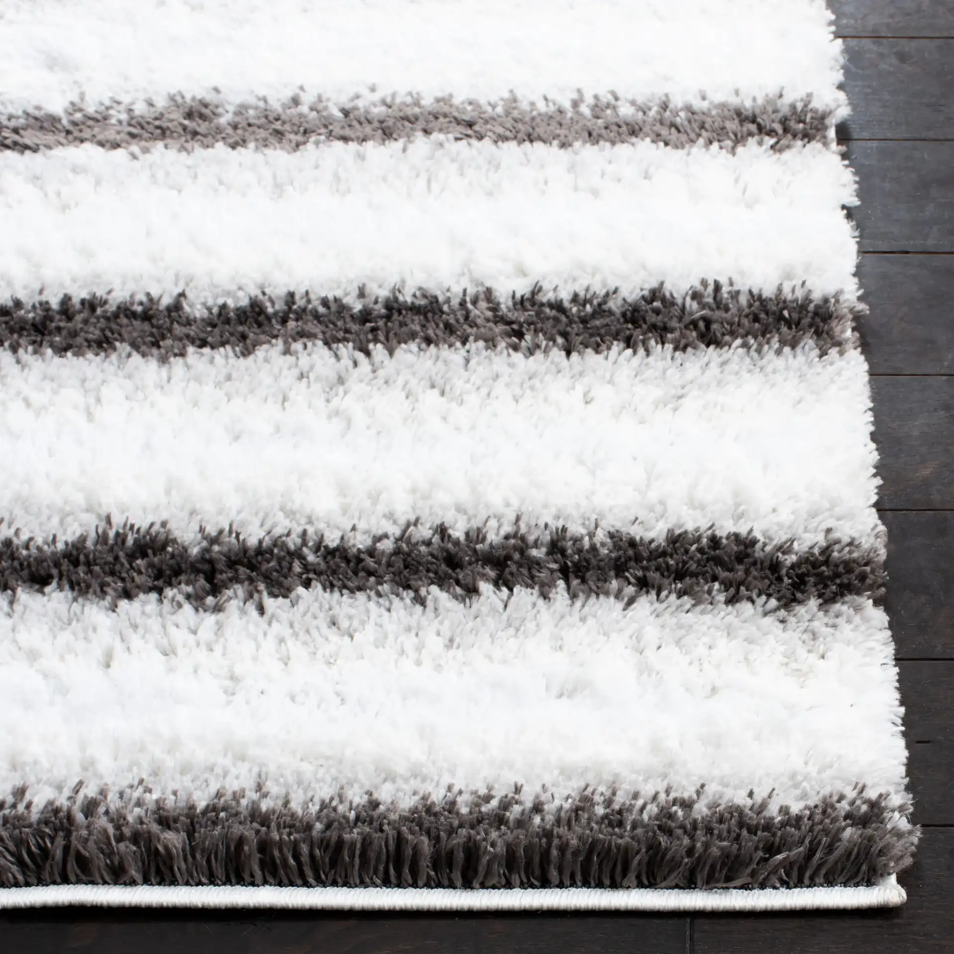 Berber Thin Horizontal Stripe Shag Rug in Ivory / Gray in a styled room