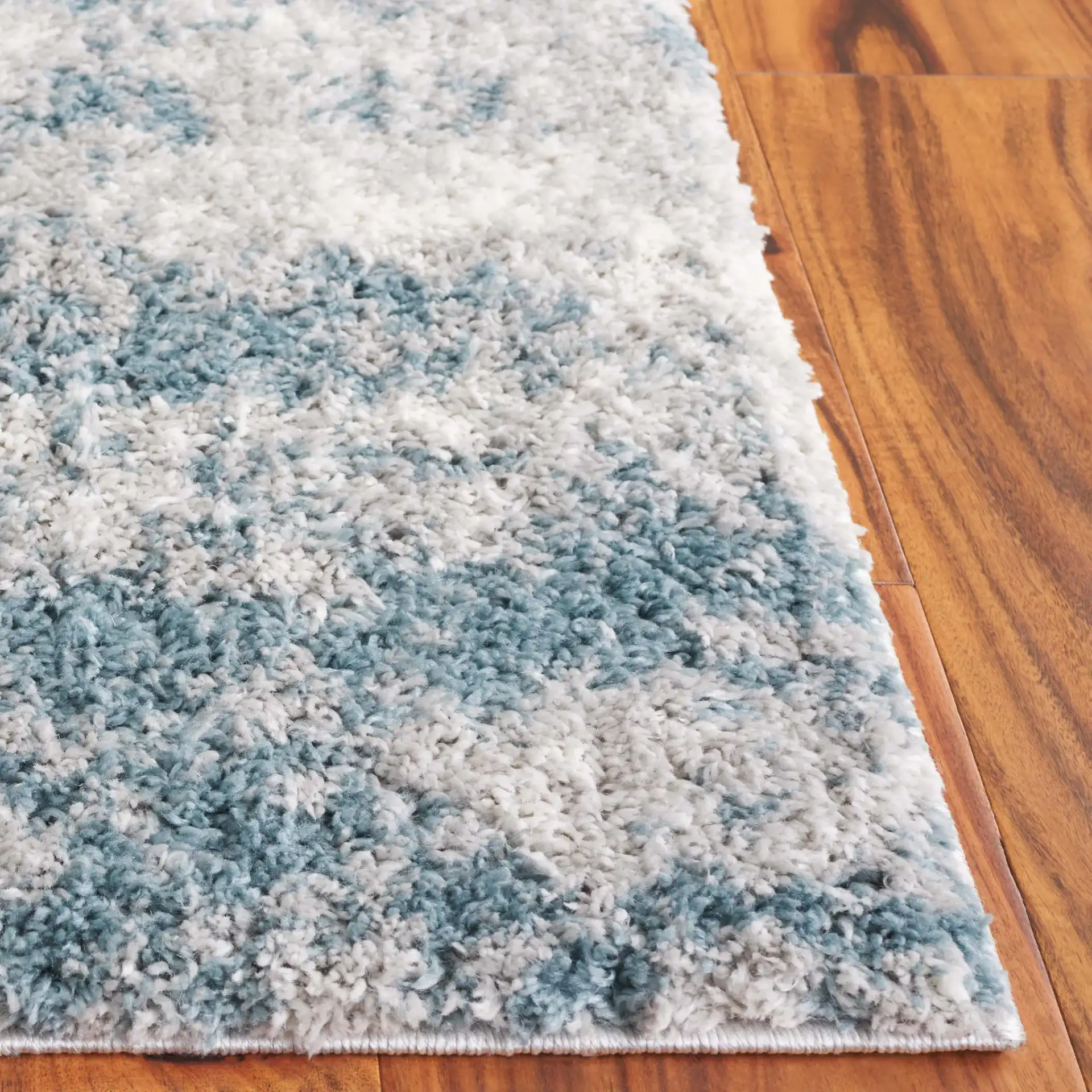 Berber Clouded Abstract Shag Rug in Ivory / Blue in a styled room