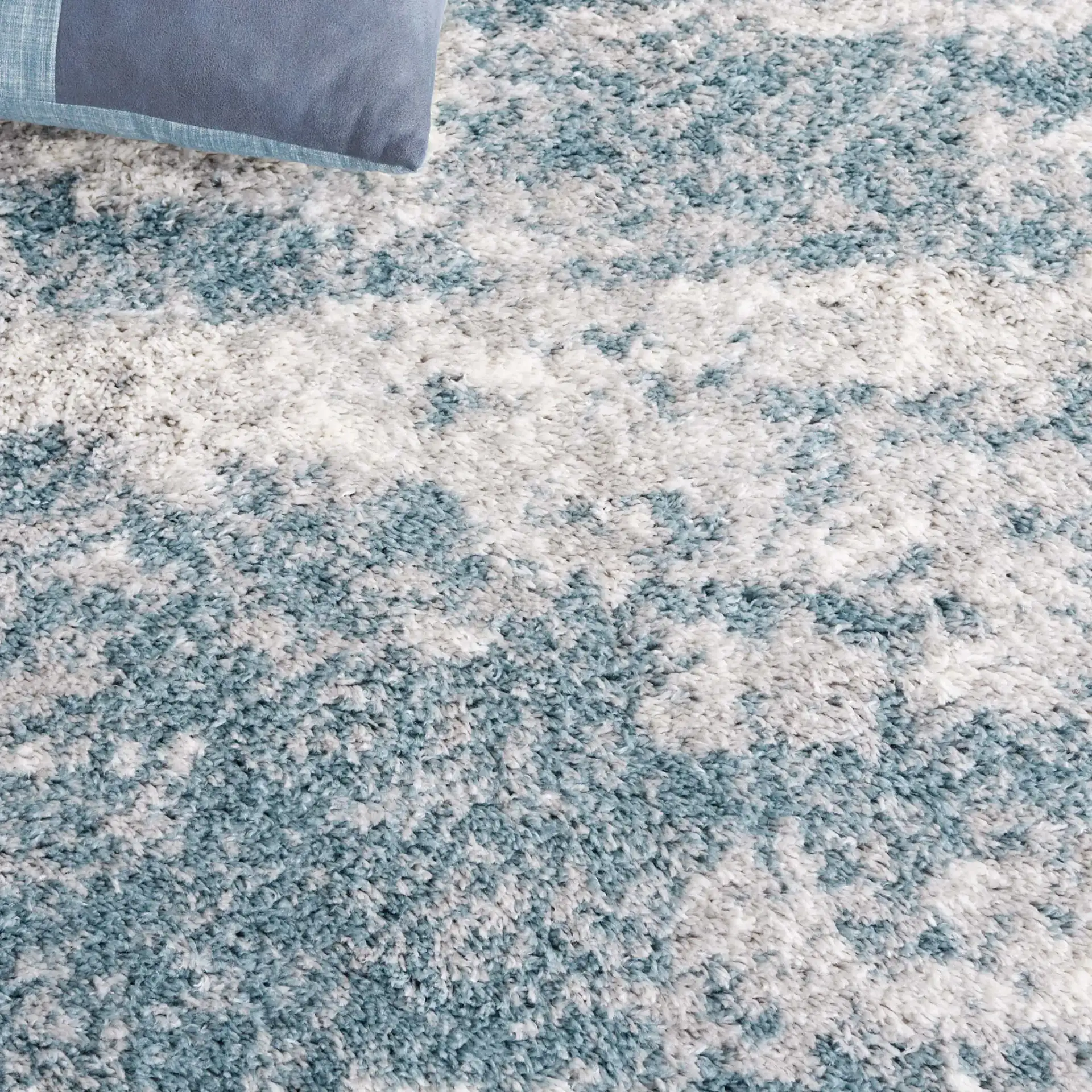 Berber Clouded Abstract Shag Rug in Ivory / Blue in a styled room