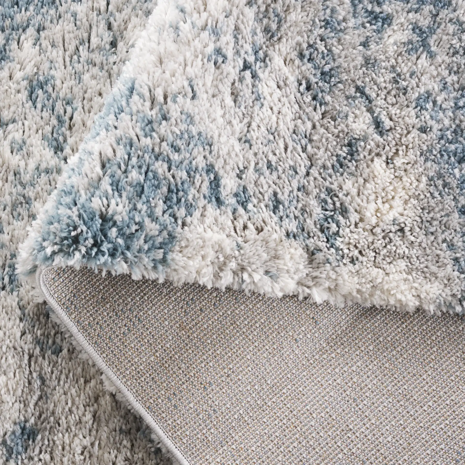 Berber Clouded Abstract Shag Rug in Ivory / Blue in a styled room