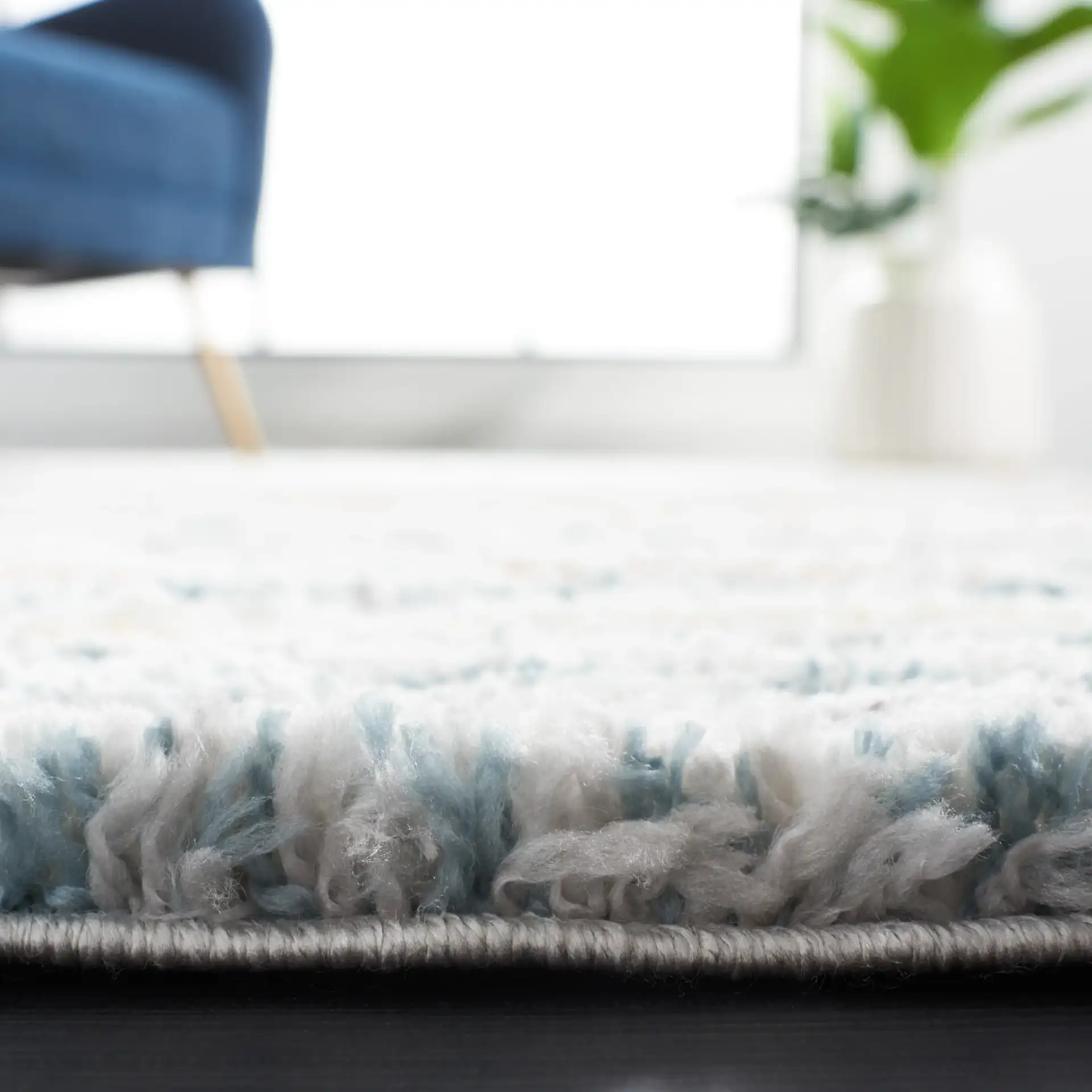 Berber Gradient Stripe Shag Rug in Blue Rust / Ivory in a styled room