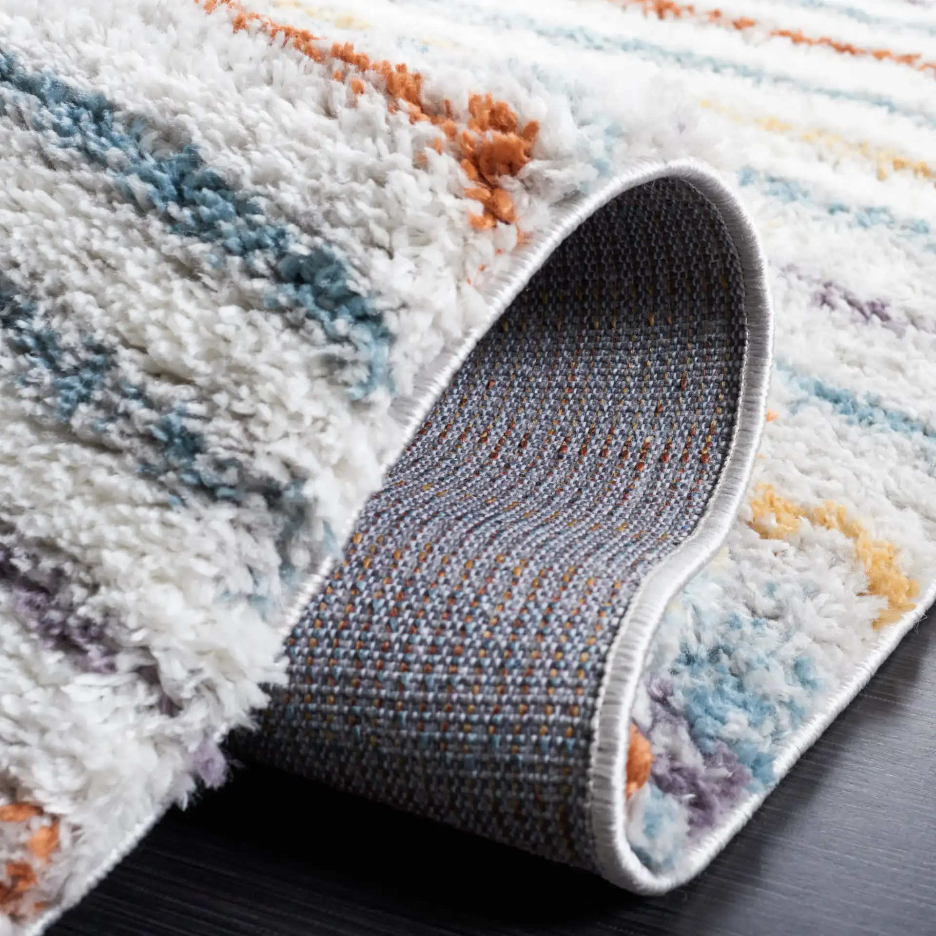 Berber Gradient Stripe Shag Rug in Blue Rust / Ivory in a styled room
