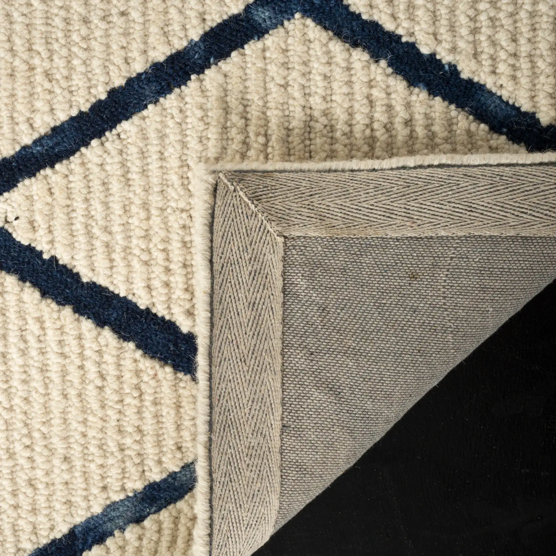 Blossom Diamond Lattice Hand-Tufted Wool Rug in Ivory / Navy in a styled room
