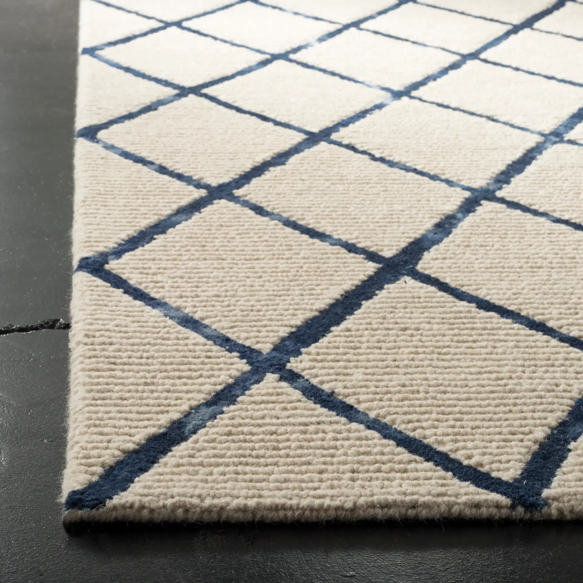 Blossom Diamond Lattice Hand-Tufted Wool Rug in Ivory / Navy in a styled room