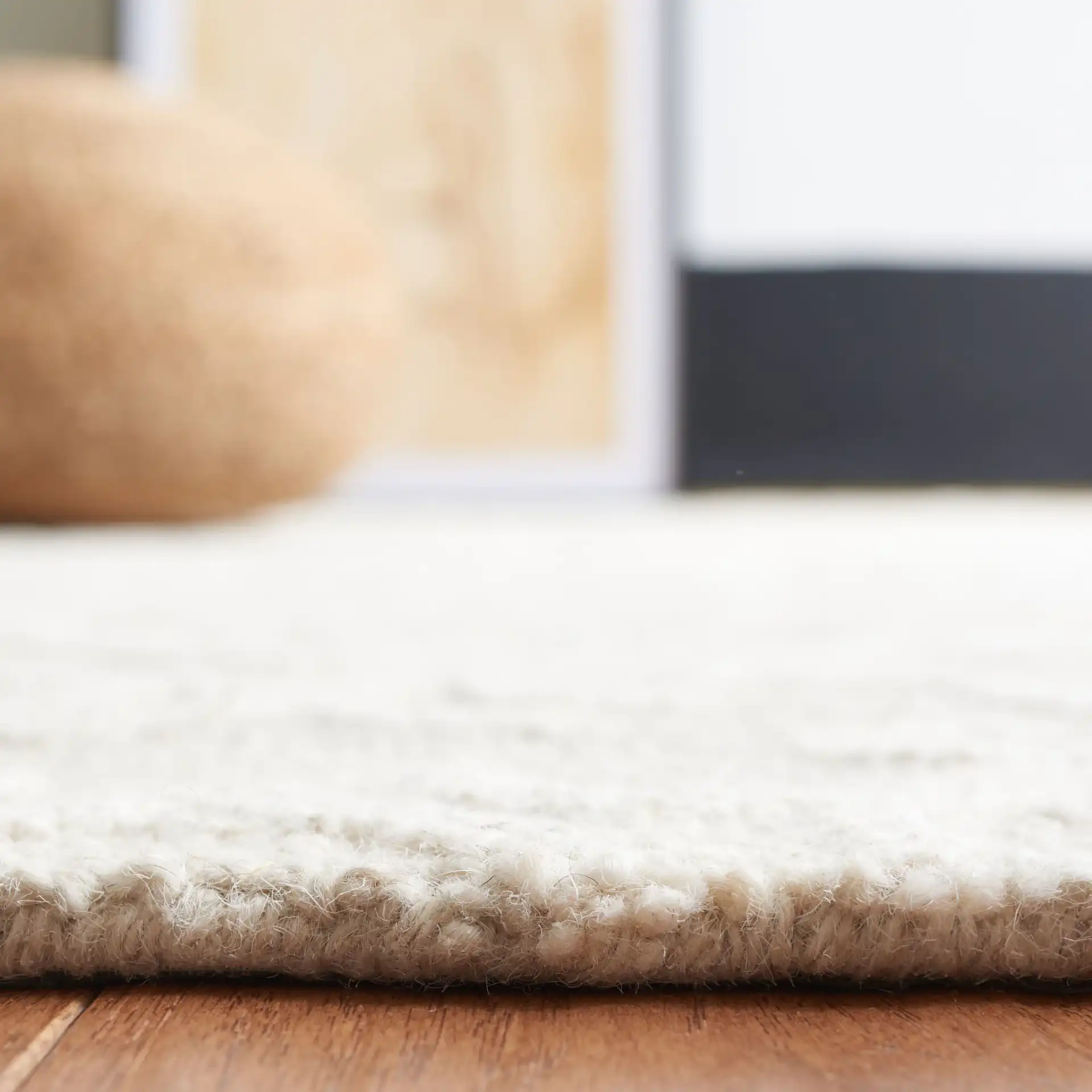 Blossom Scrollwork Hand-Tufted Wool Rug in Gray / Ivory in a styled room