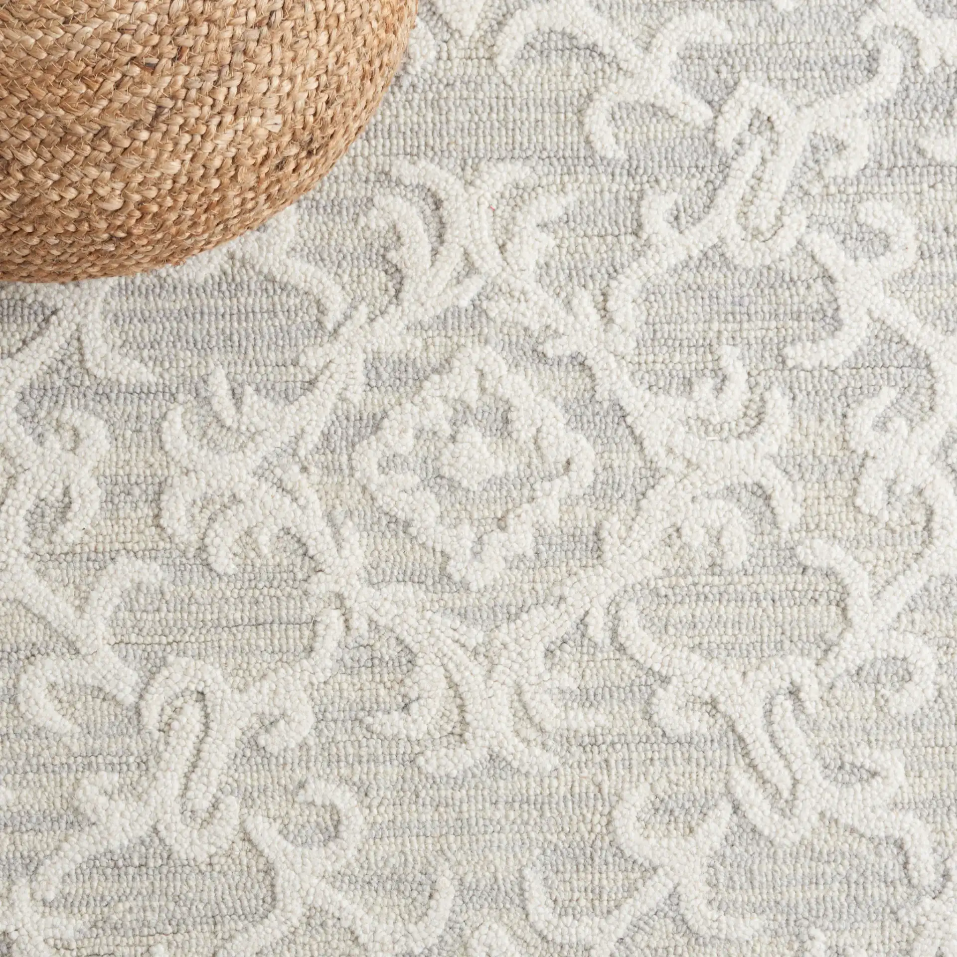Blossom Scrollwork Hand-Tufted Wool Rug in Gray / Ivory in a styled room