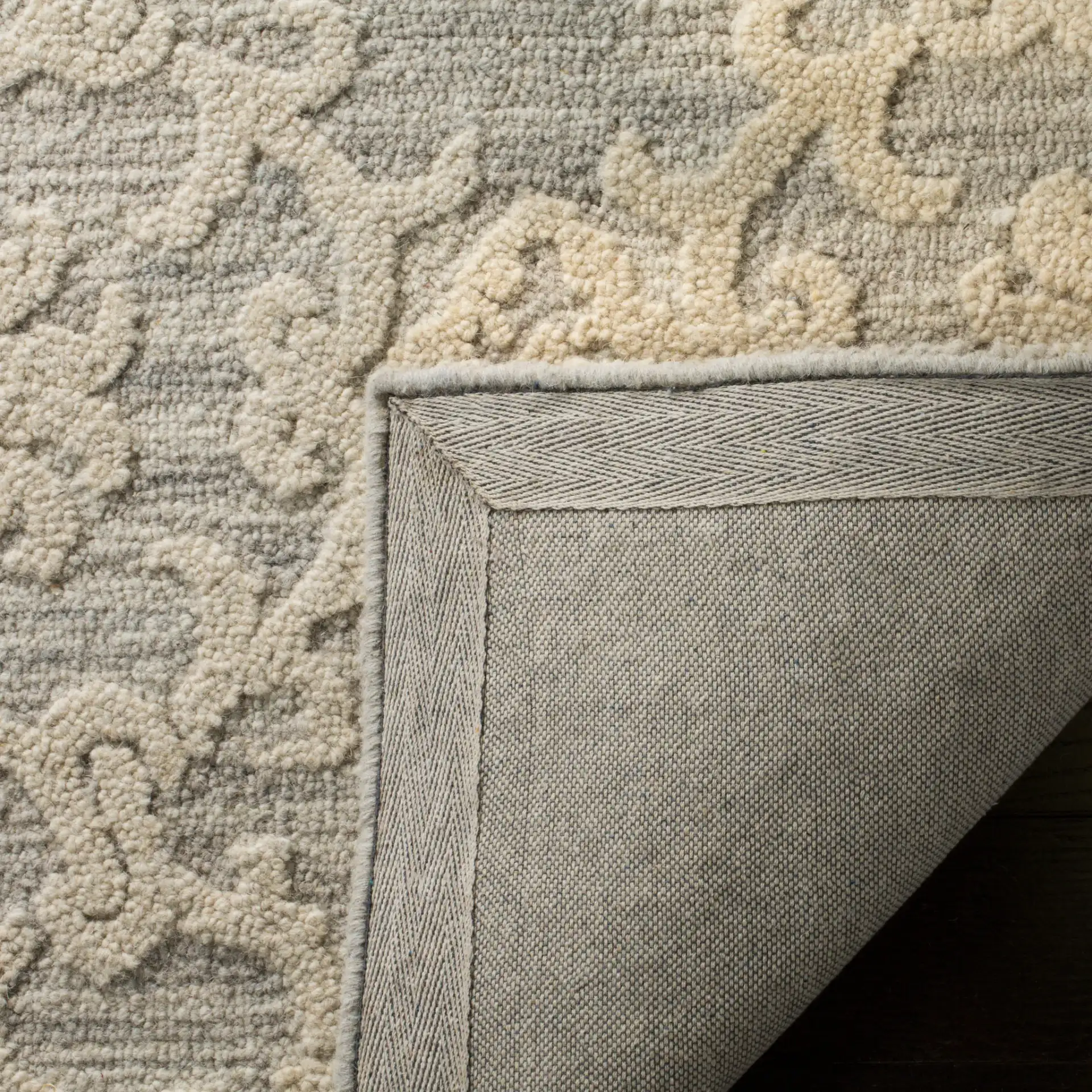 Blossom Scrollwork Hand-Tufted Wool Rug in Gray / Ivory in a styled room