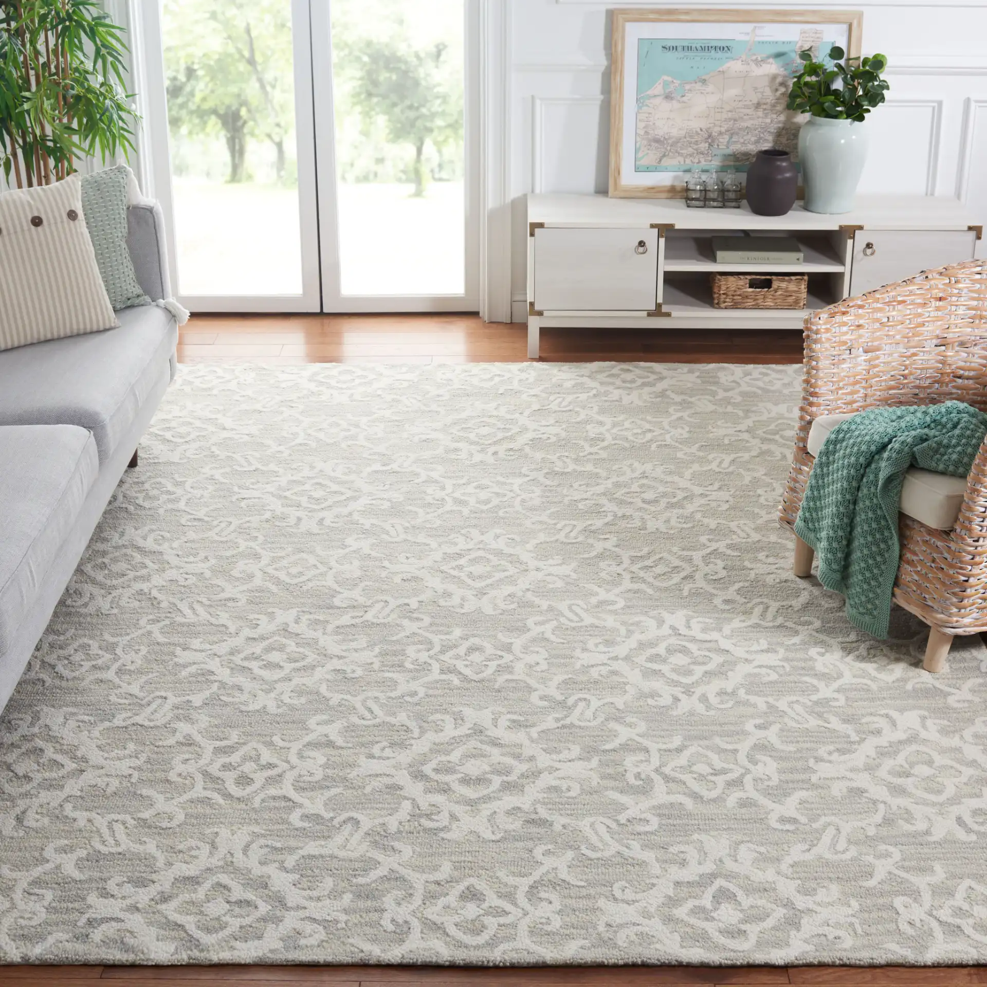 Blossom Scrollwork Hand-Tufted Wool Rug in Gray / Ivory in a styled room