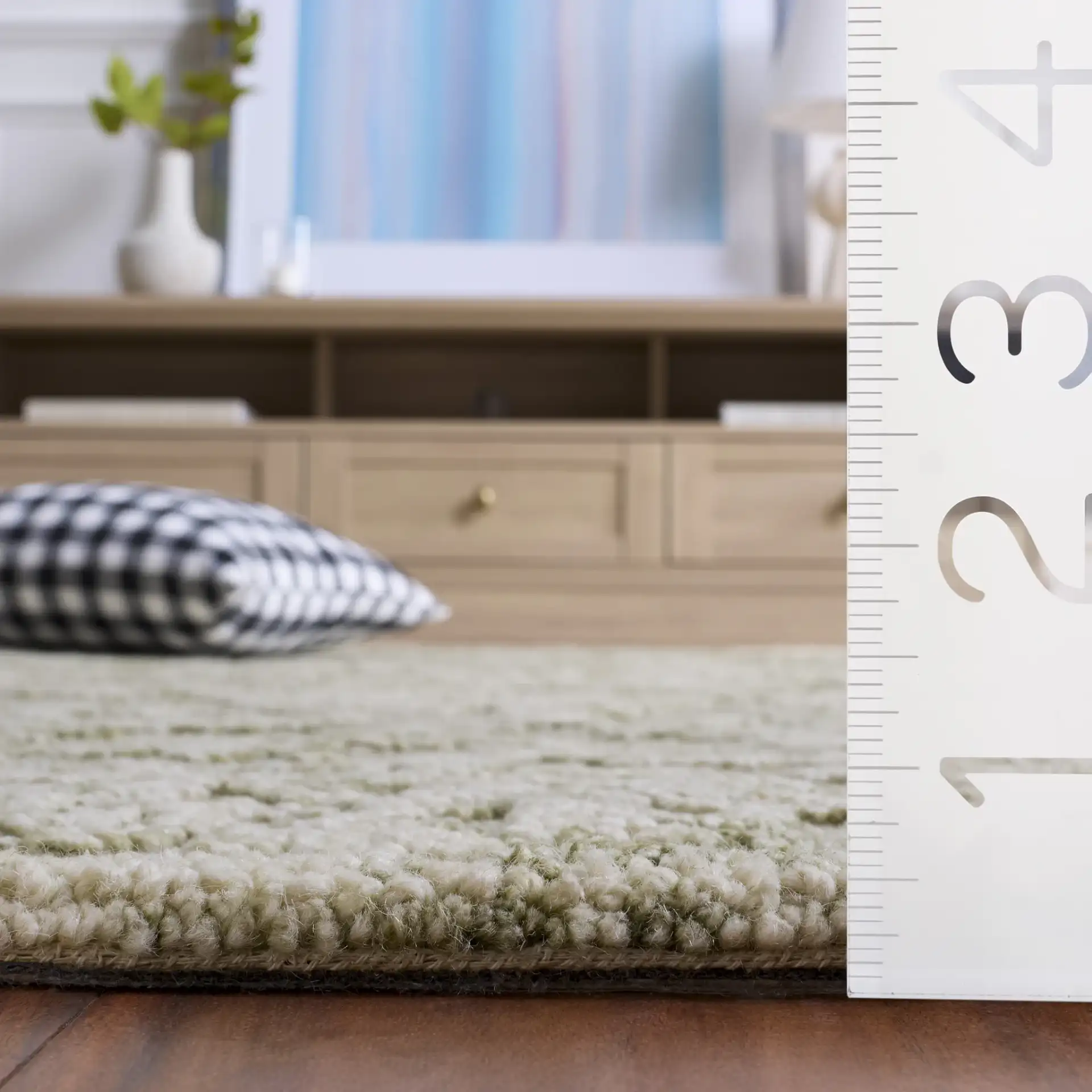 Blossom Damask Vine Hand-Tufted Wool Rug in Sage / Ivory in a styled room